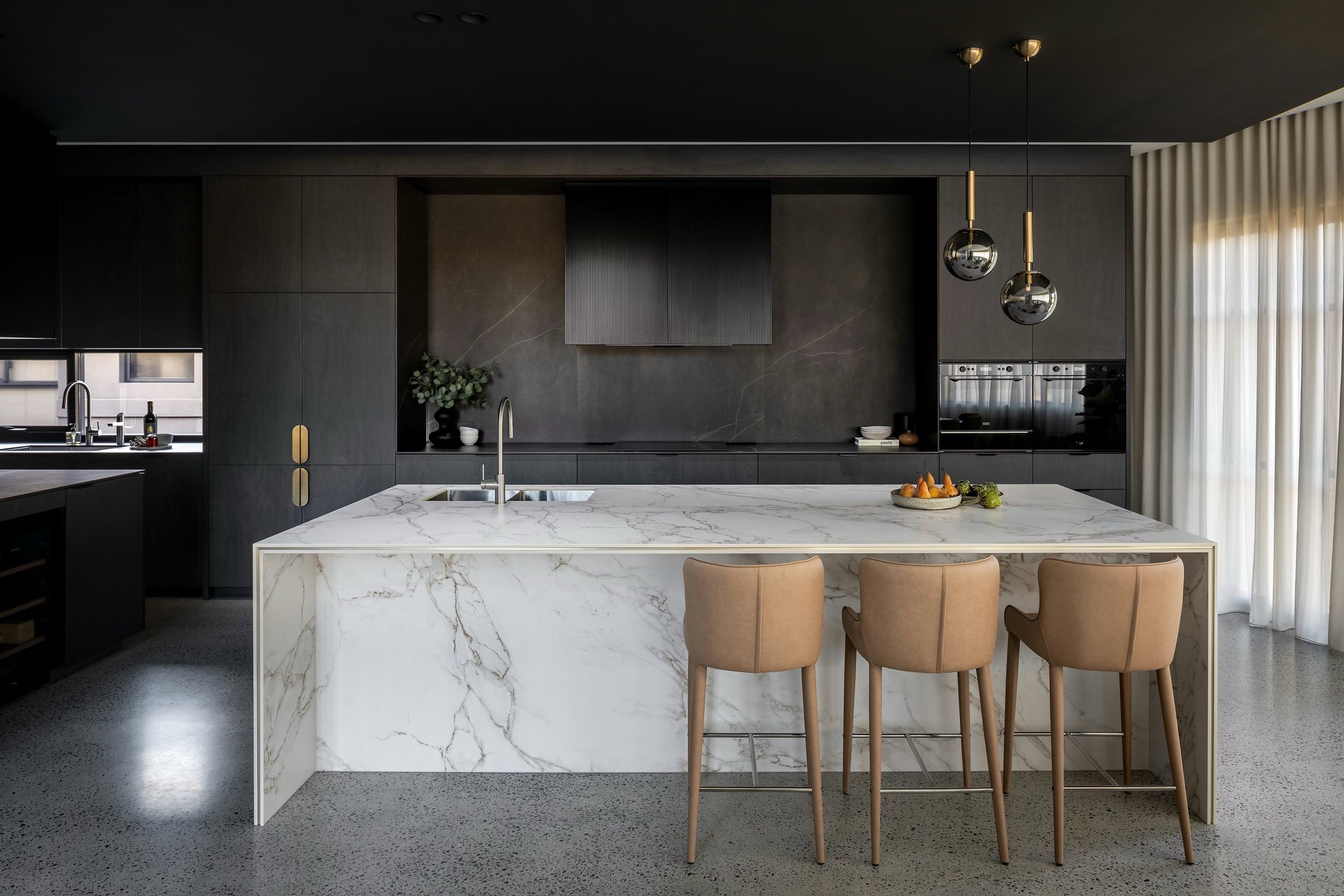 an abstract photo of a curved building with a blue sky in the background