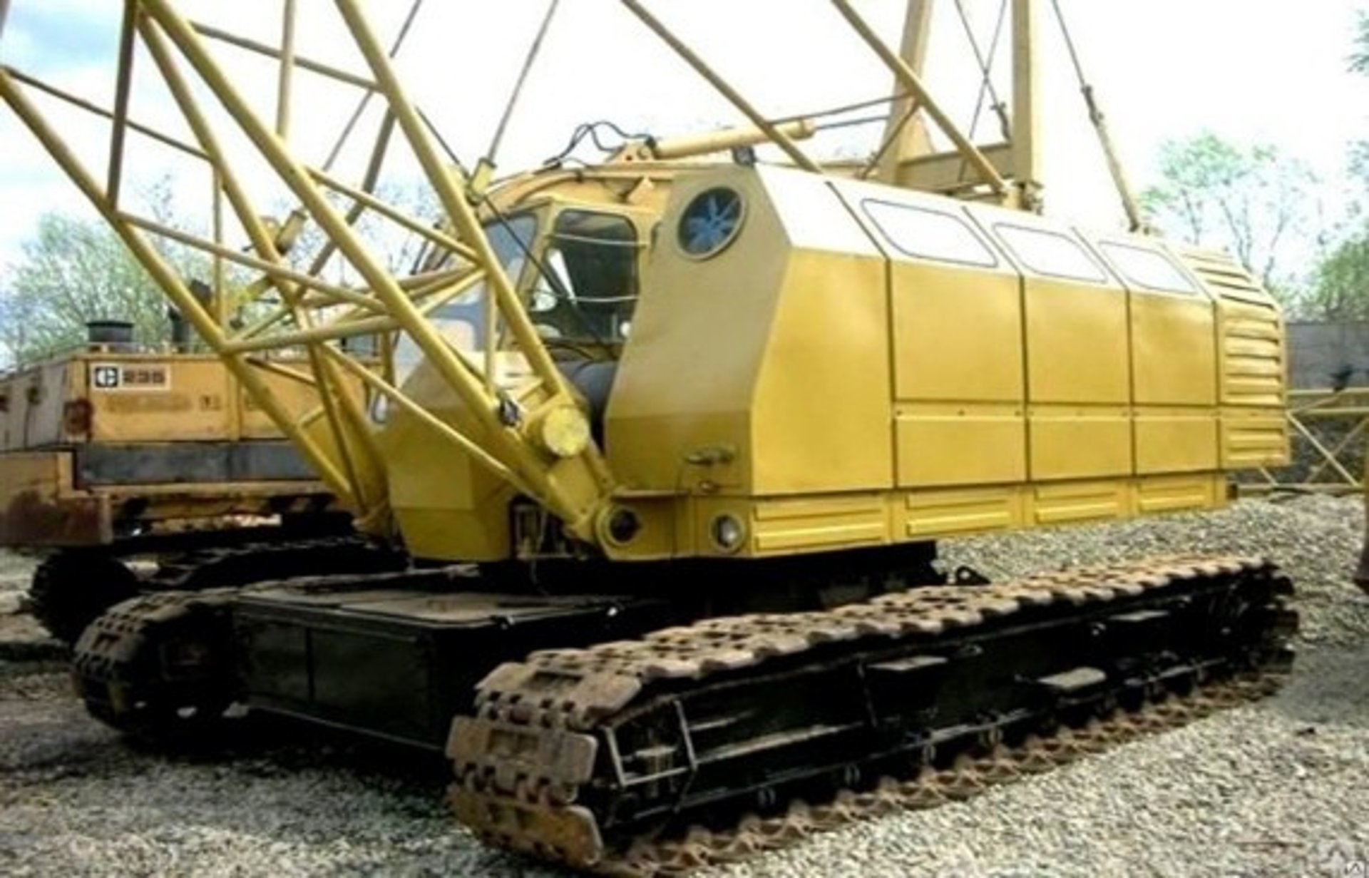 black and orange metal machine on green grass field during daytime