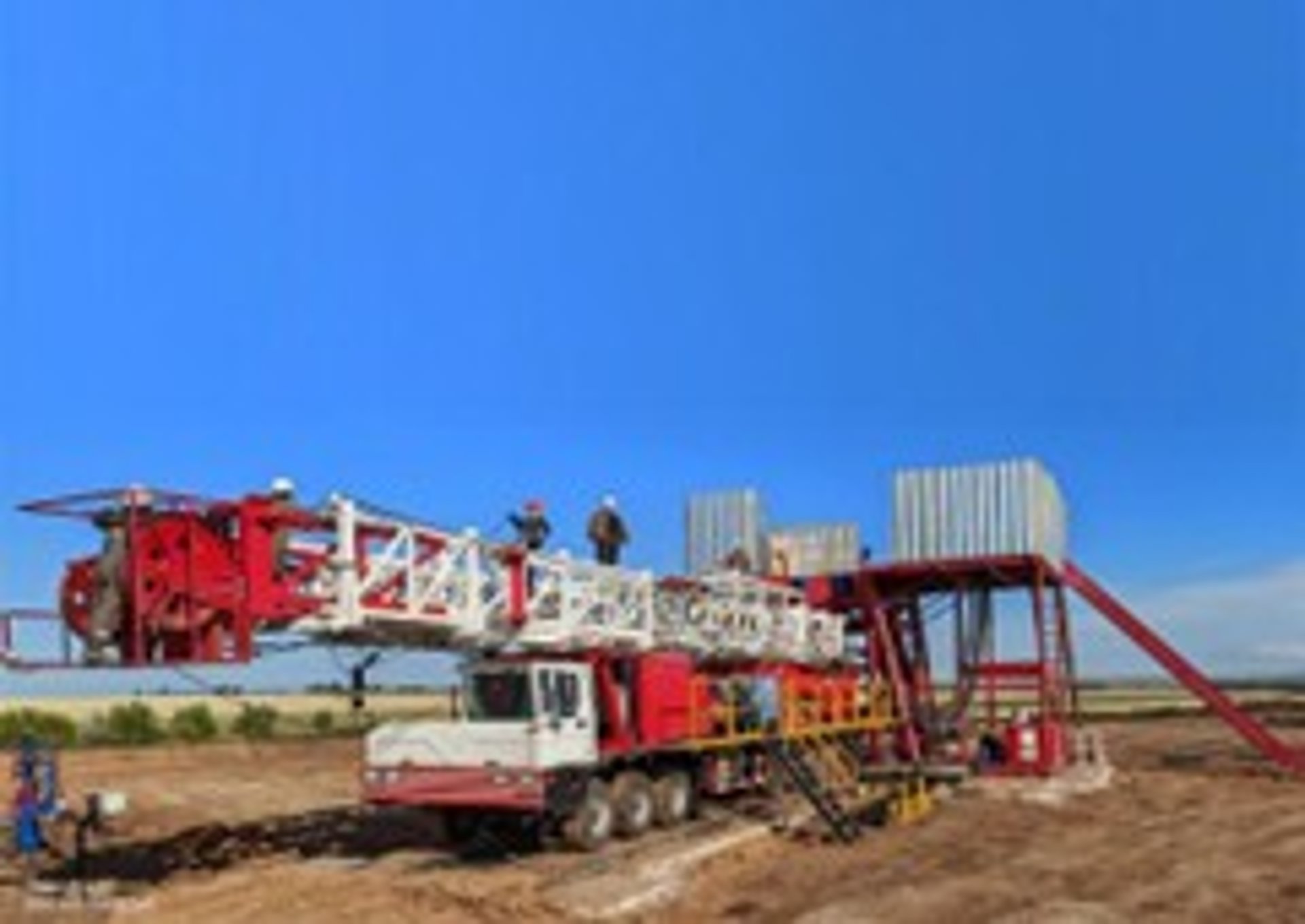 black and orange metal machine on green grass field during daytime