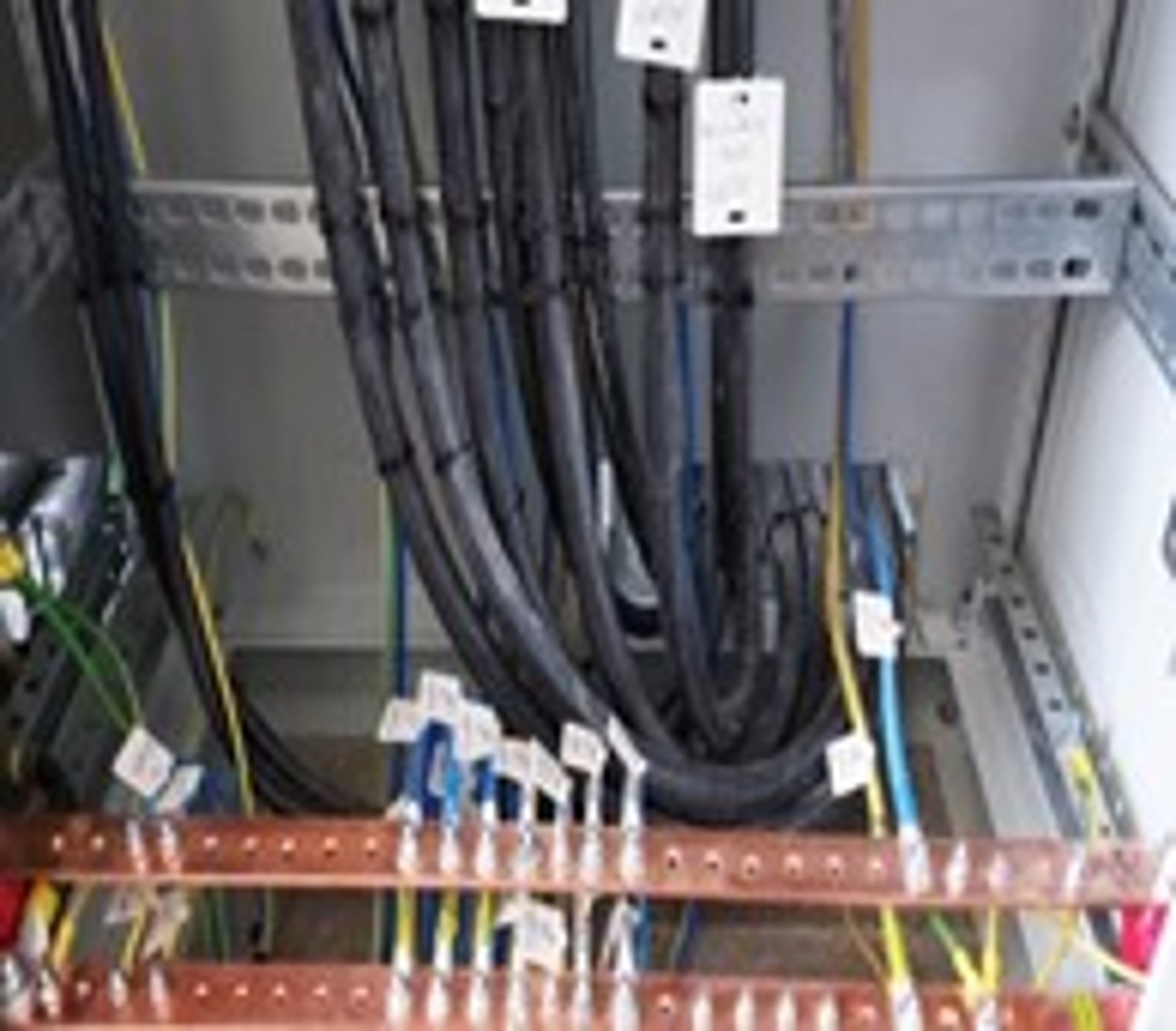 black and orange metal machine on green grass field during daytime