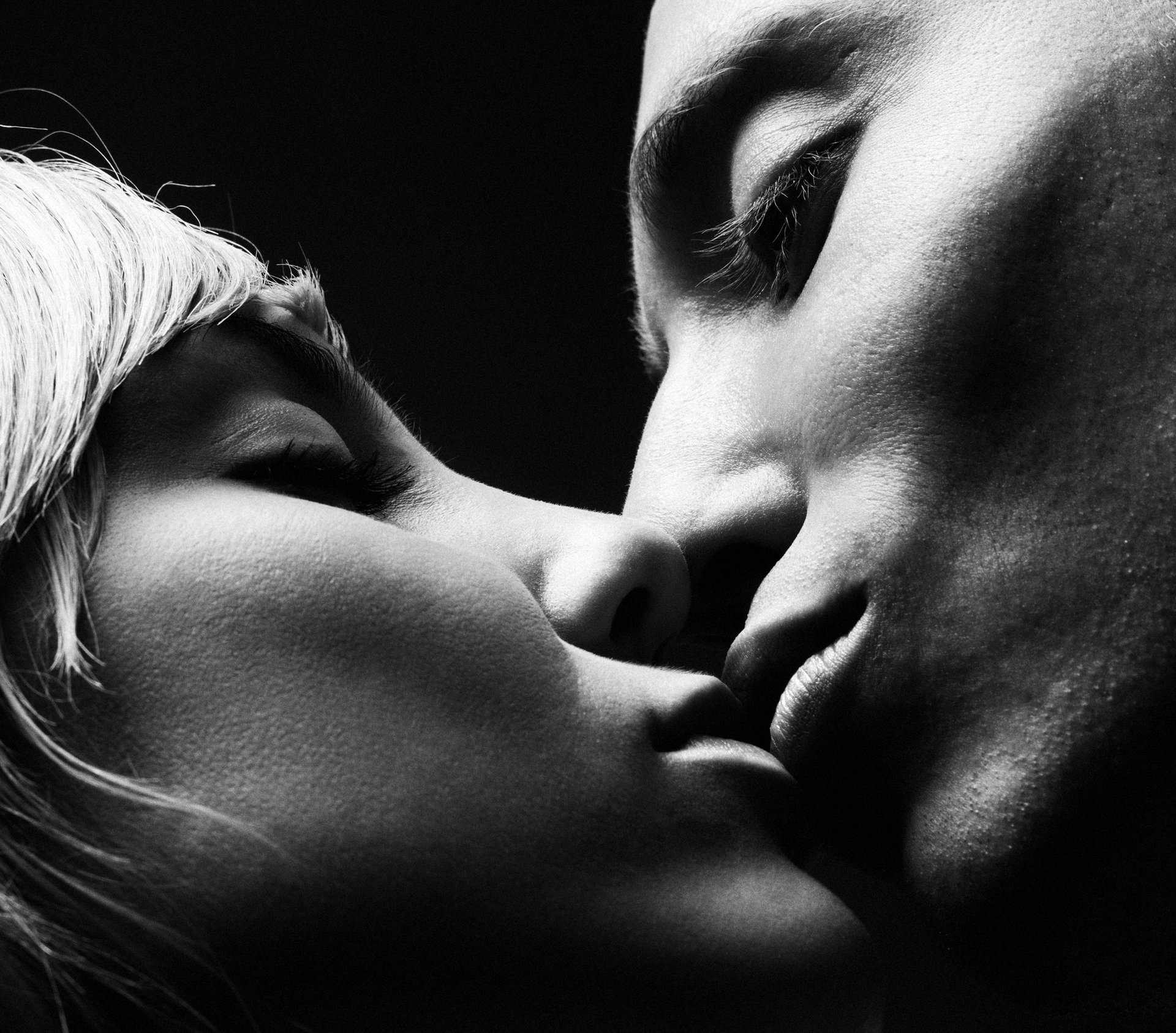 Artistic black and white engagement couple portrait with closeup focus. Professional Madeira photographer.