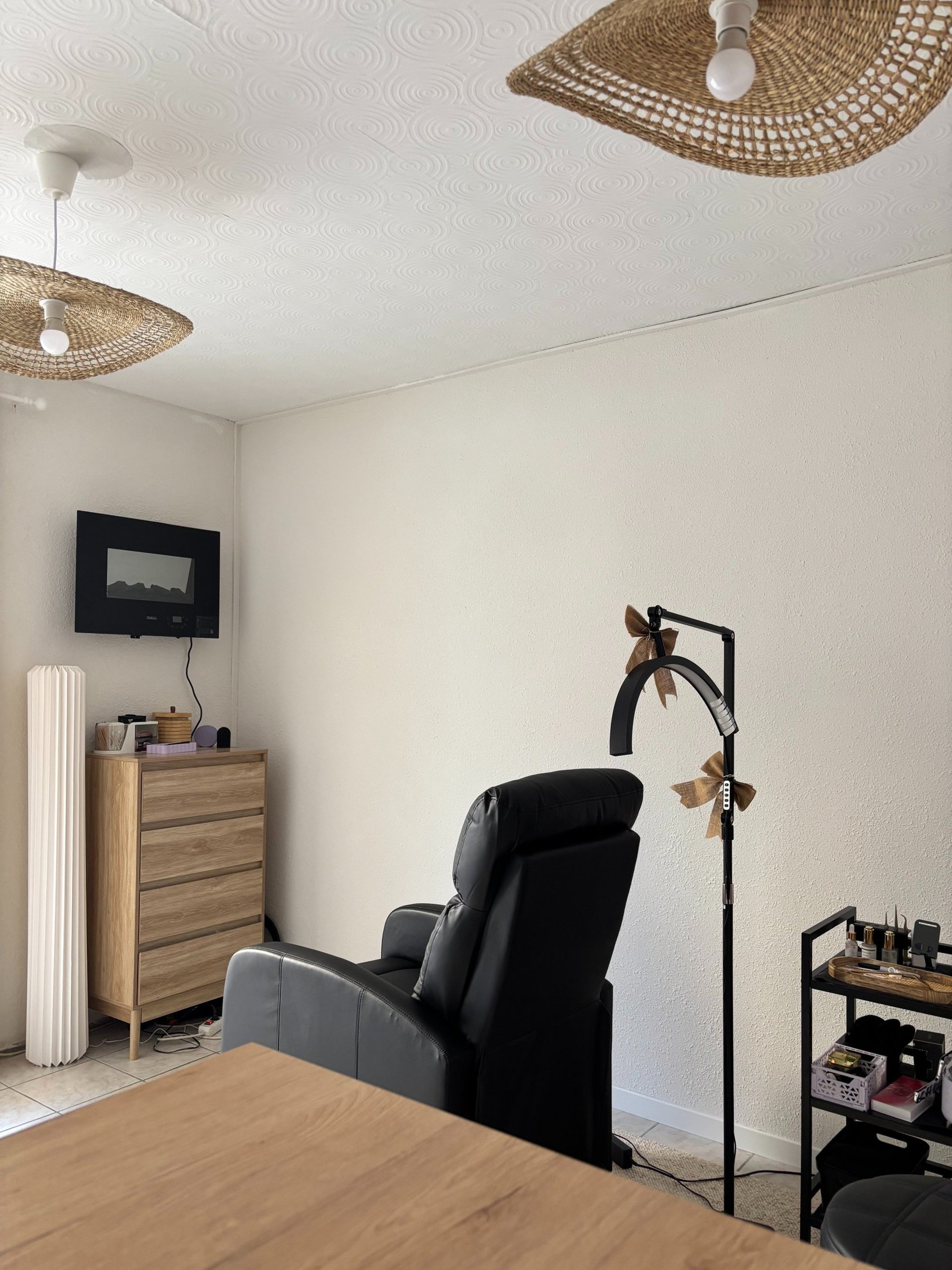 a living room filled with furniture and a clock on the wall