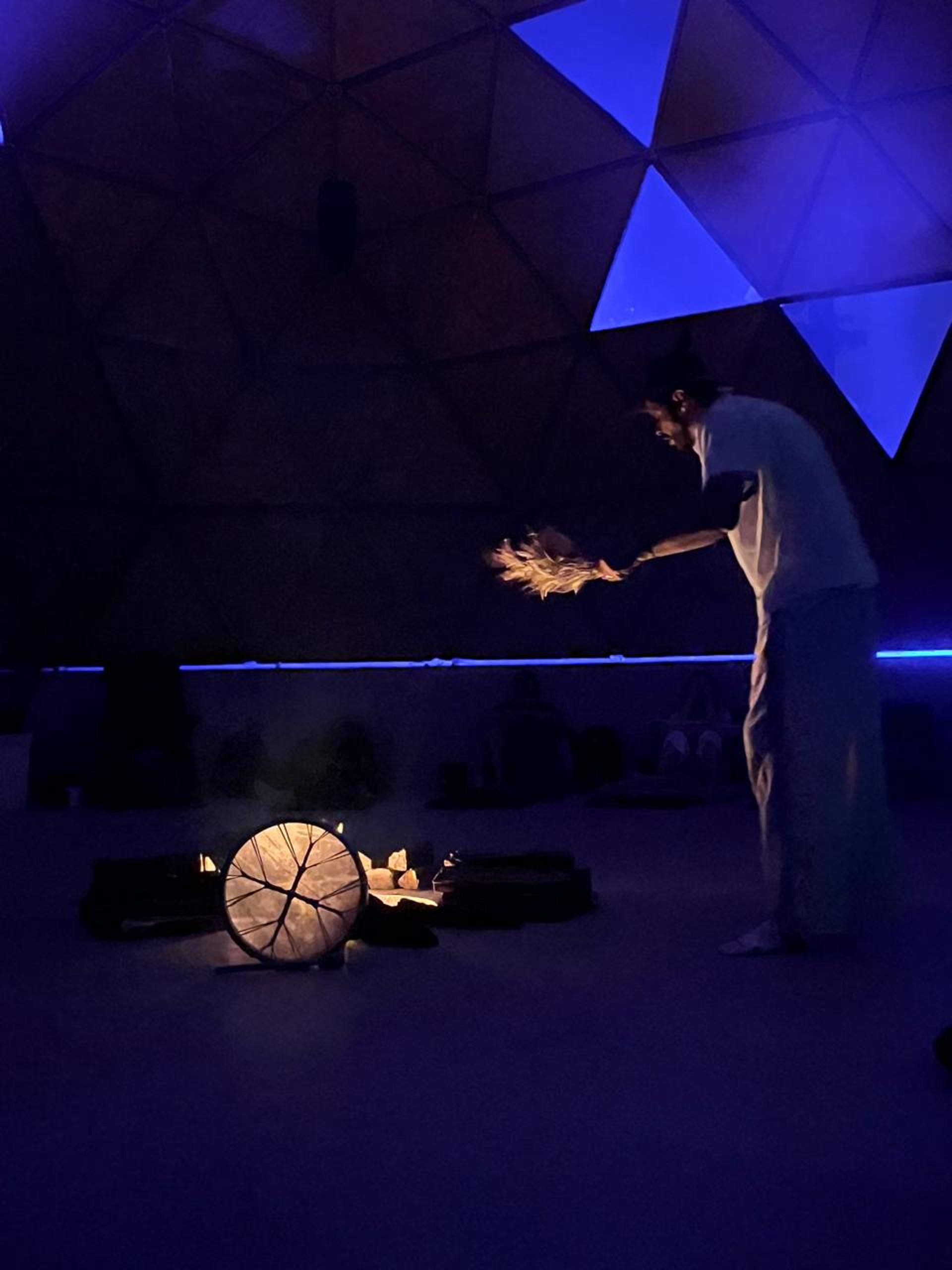 an abstract photo of a curved building with a blue sky in the background