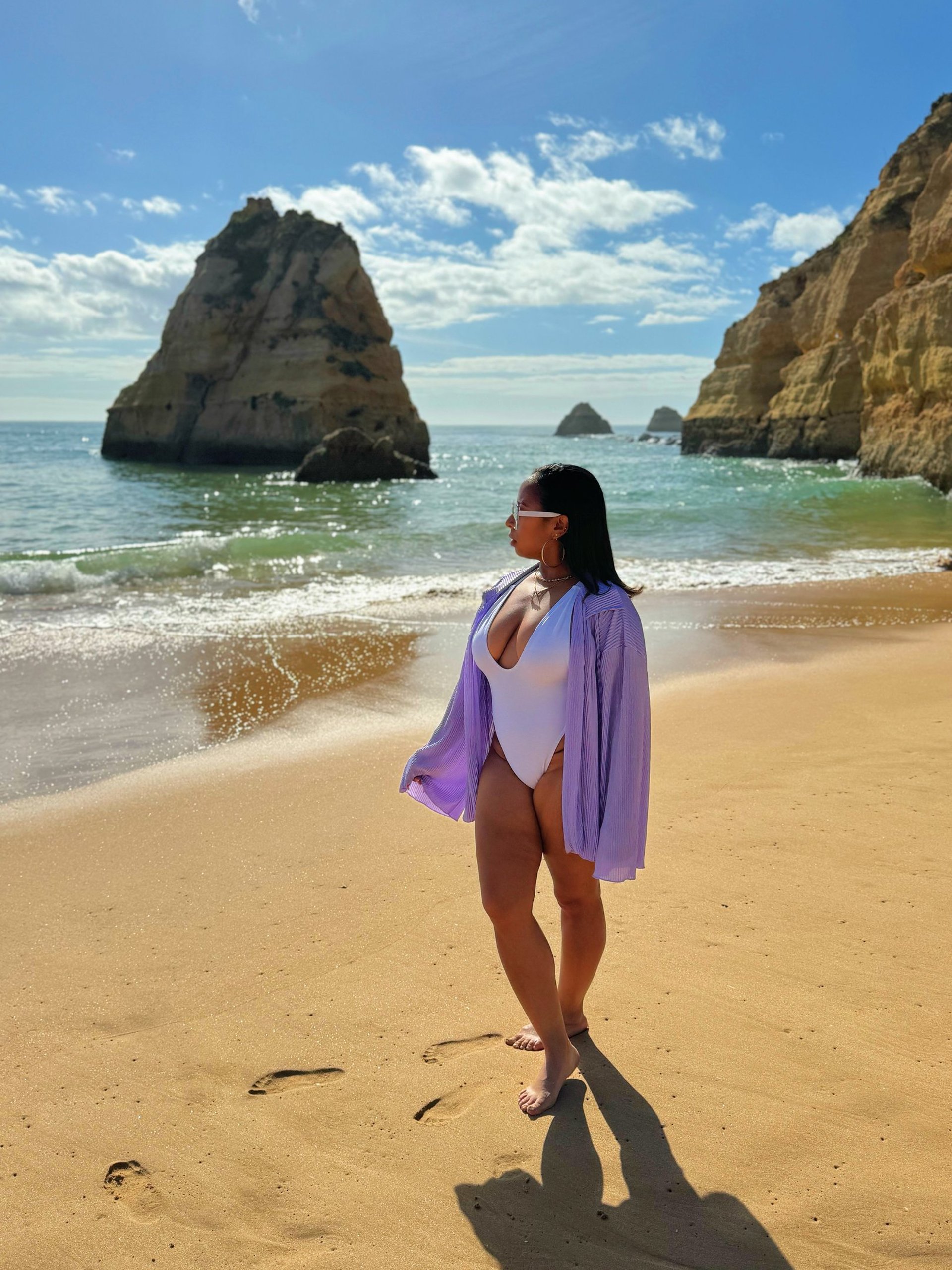 an abstract photo of a curved building with a blue sky in the background