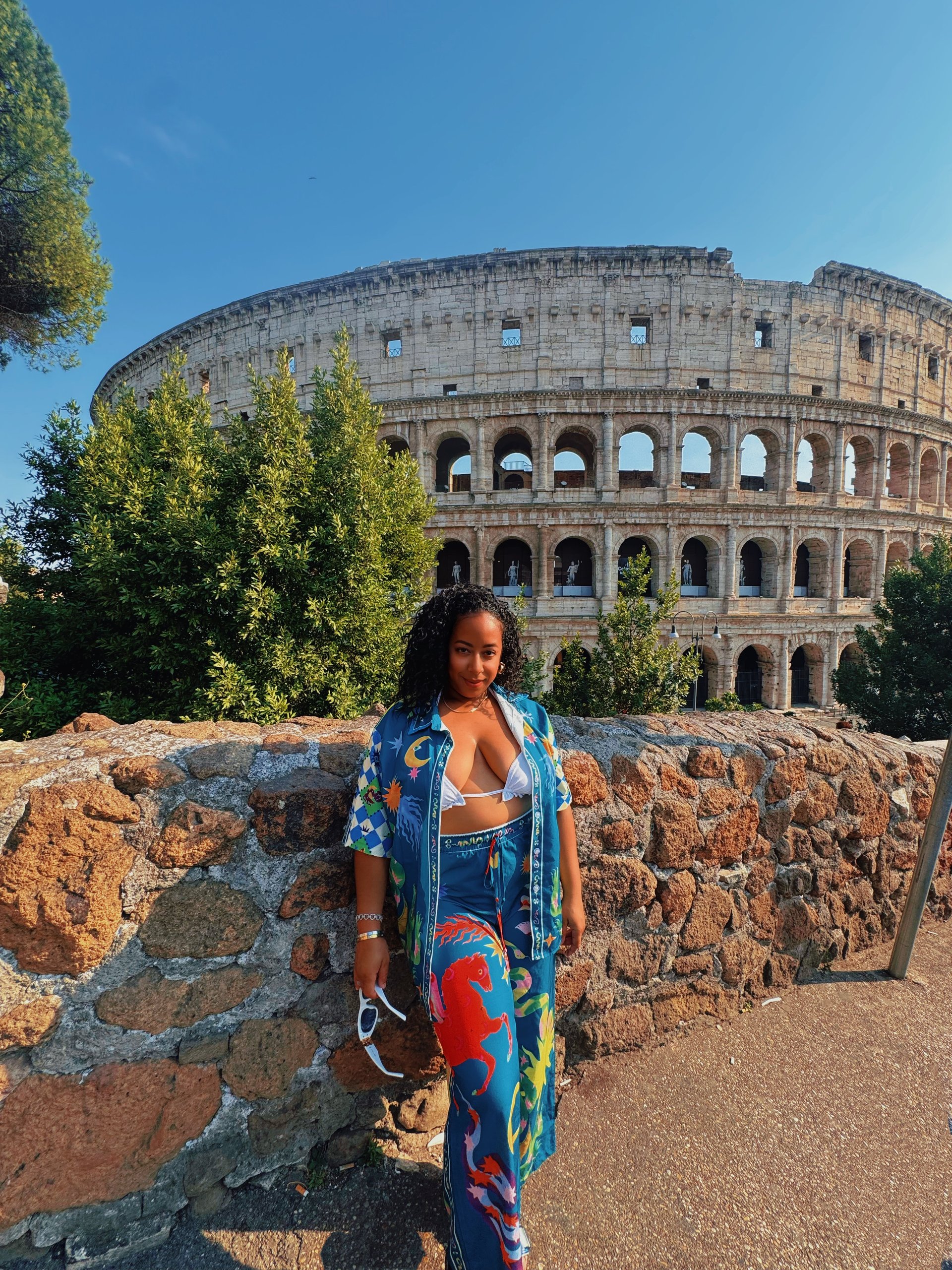 an abstract photo of a curved building with a blue sky in the background