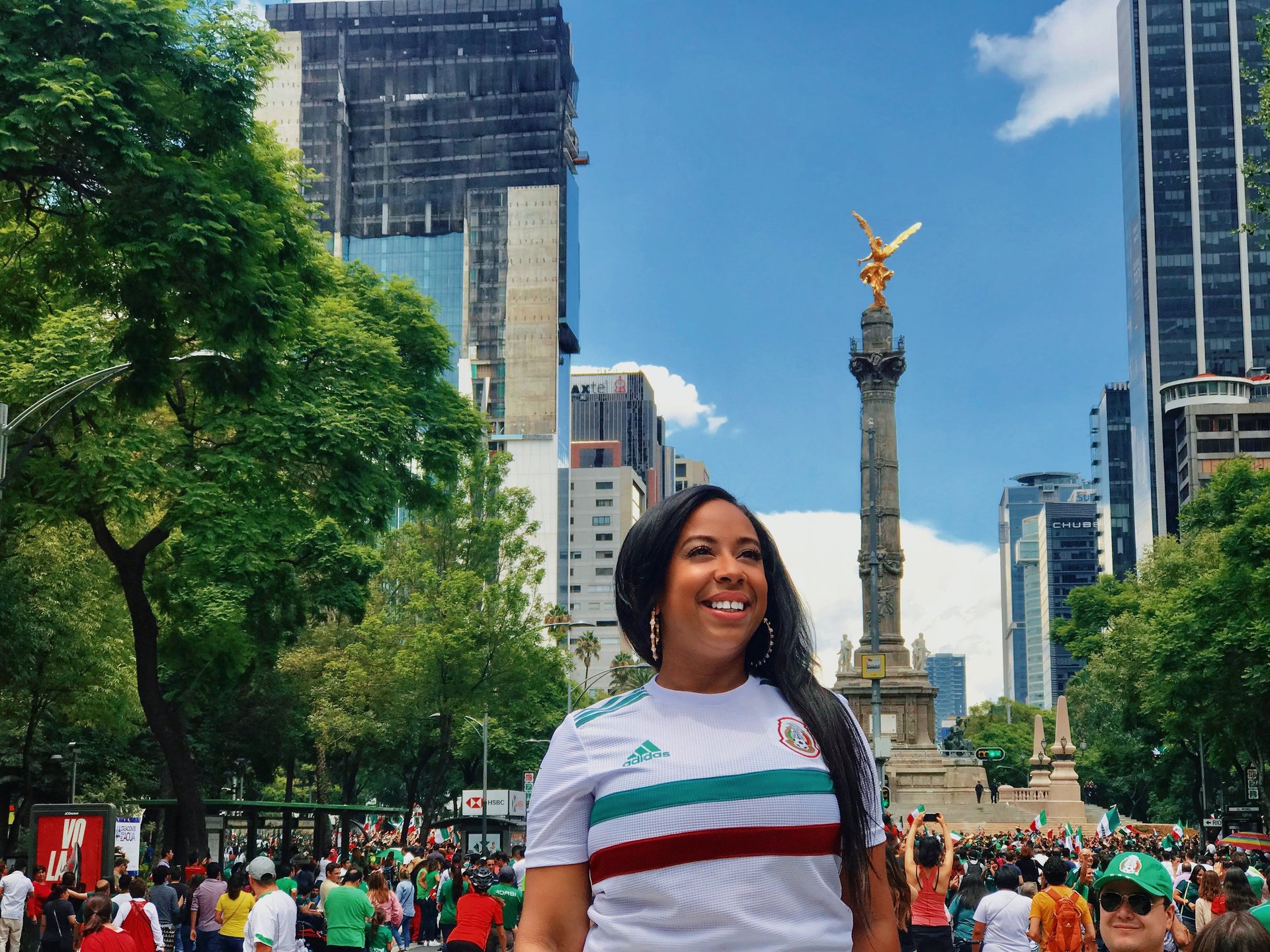 an abstract photo of a curved building with a blue sky in the background