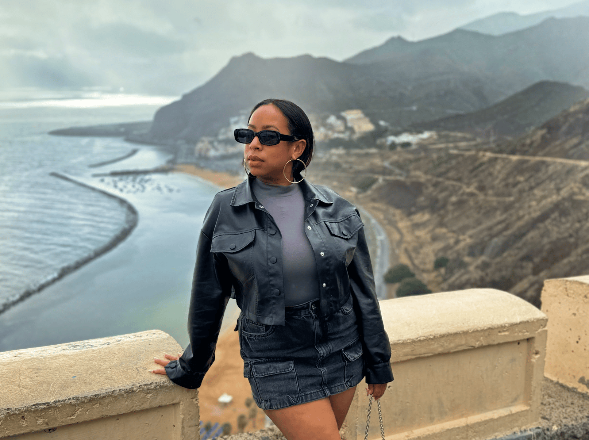 an abstract photo of a curved building with a blue sky in the background
