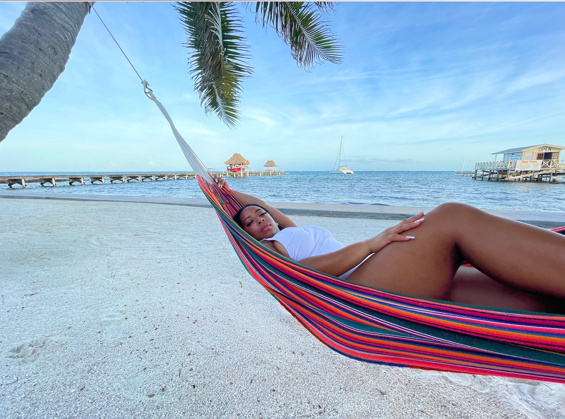 an abstract photo of a curved building with a blue sky in the background