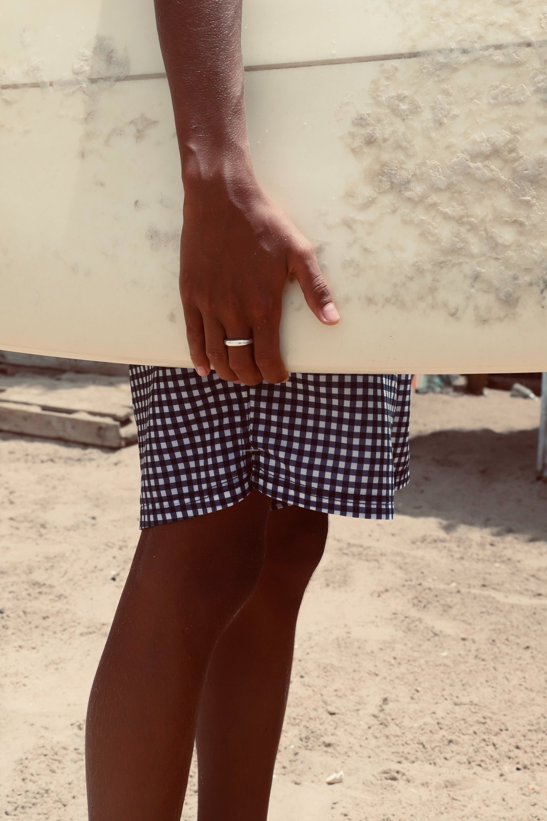 Courtyard with large tree and adobe buildings