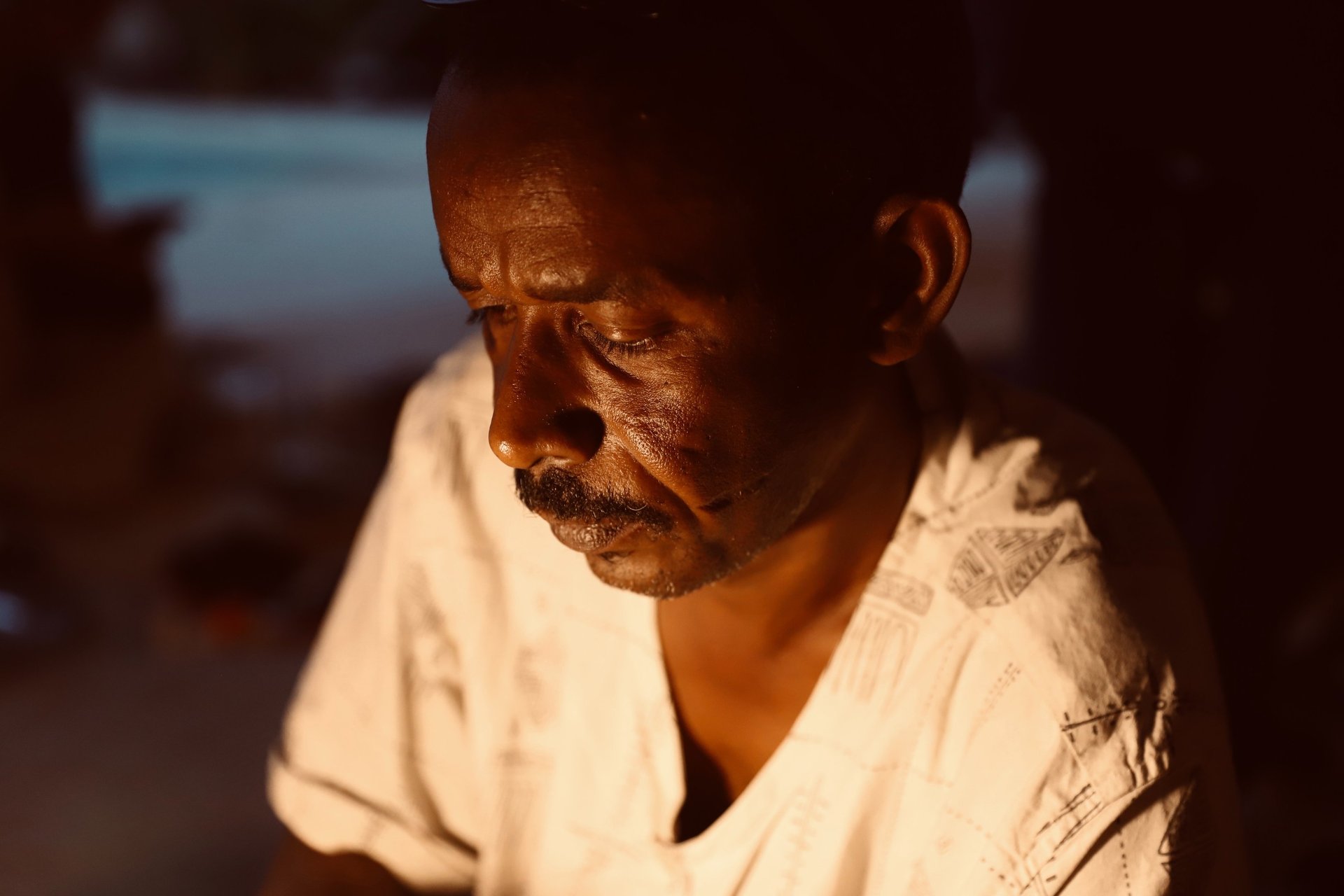 three camels with people riding them in the desert