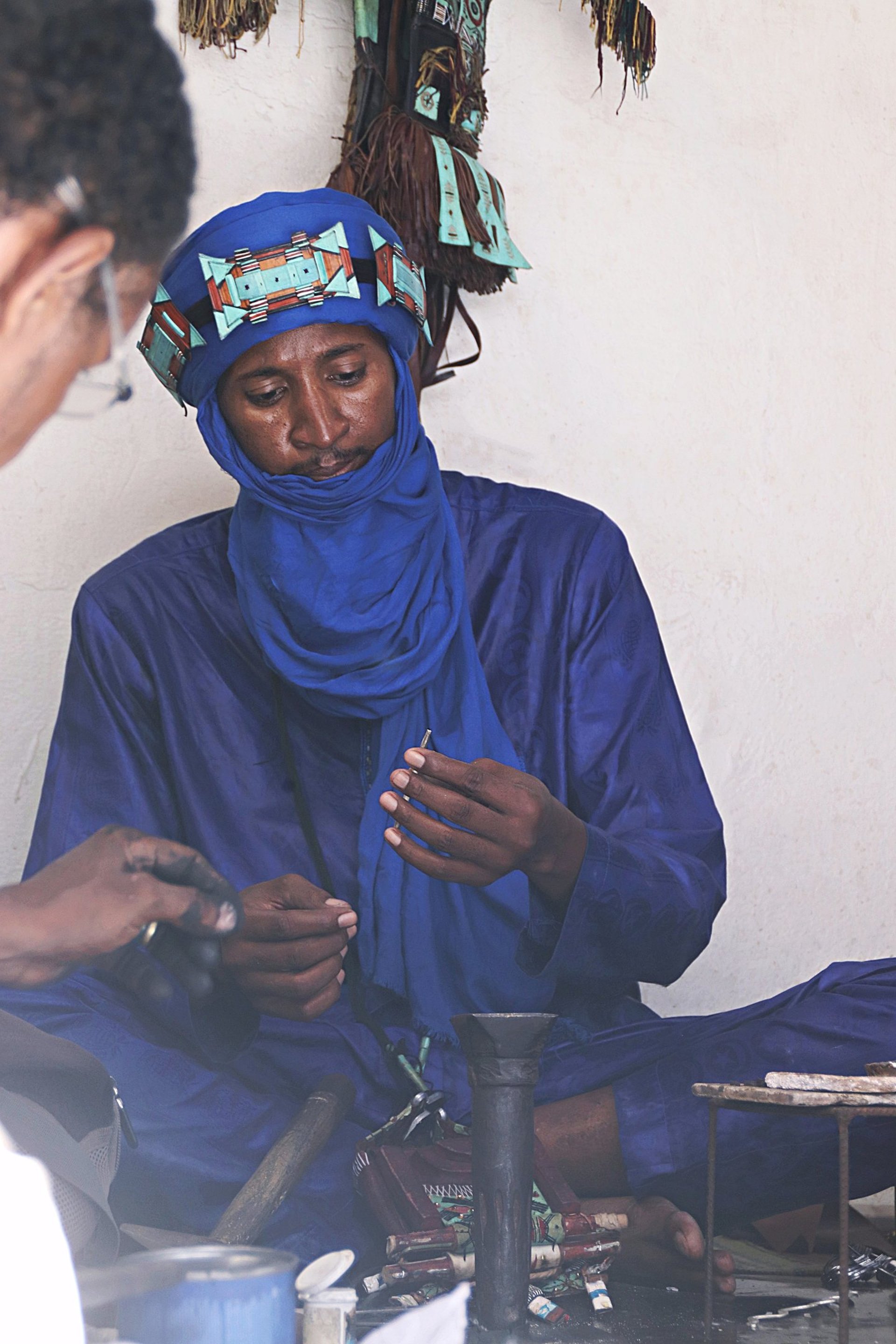 three camels with people riding them in the desert