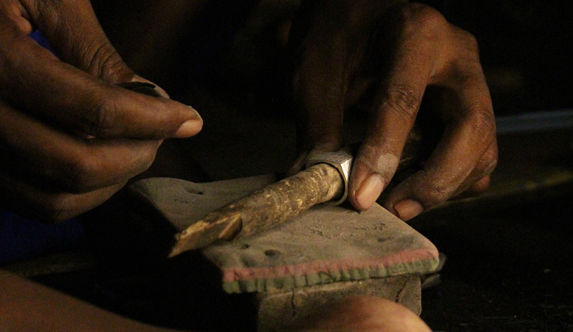 A woman walking down a street in a village