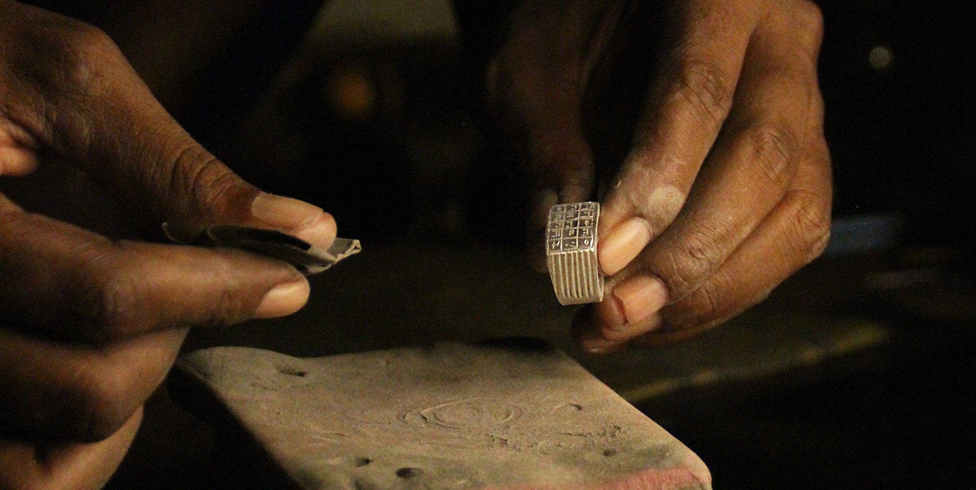 a person sitting on a ledge