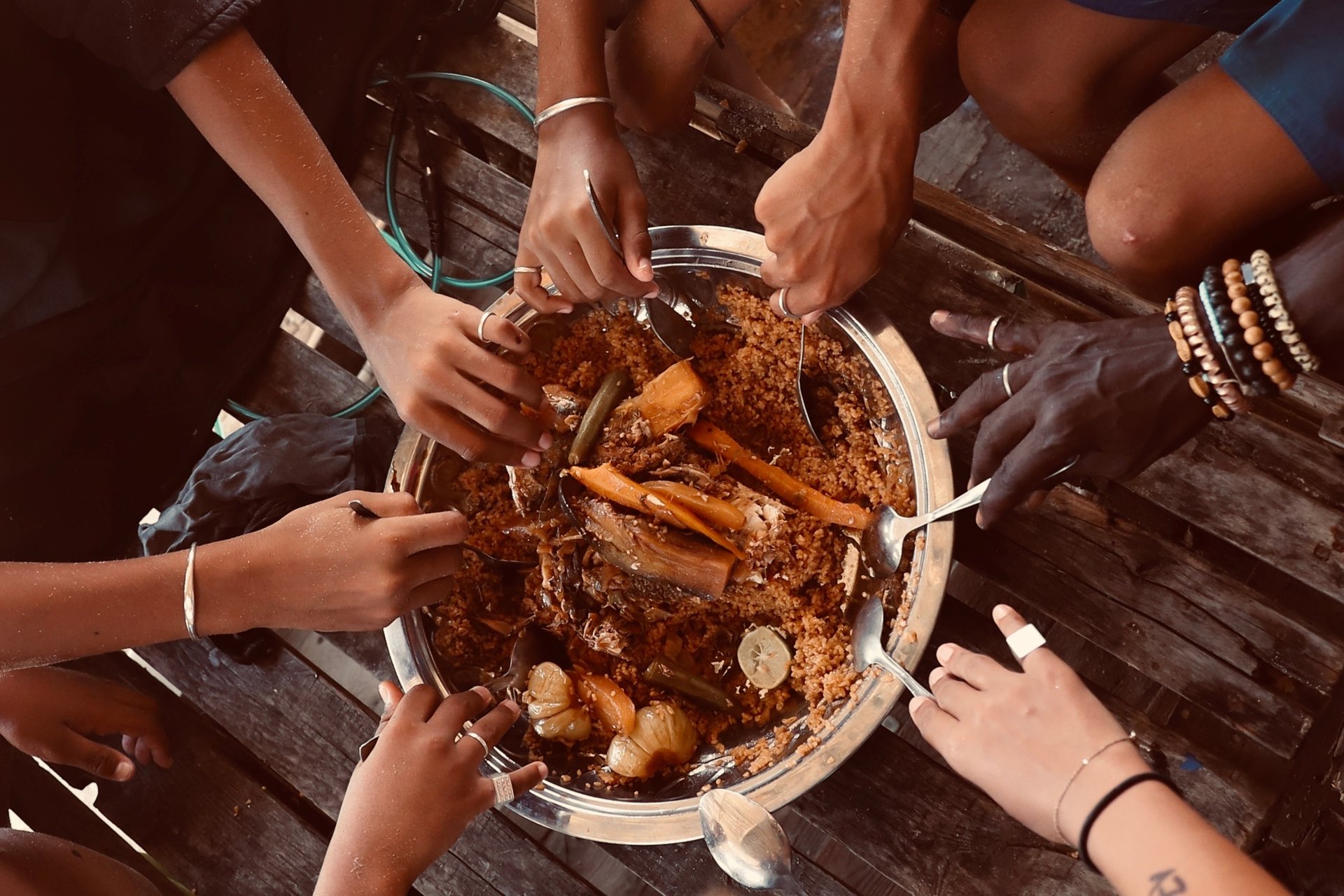a group of three camels walking across a desert