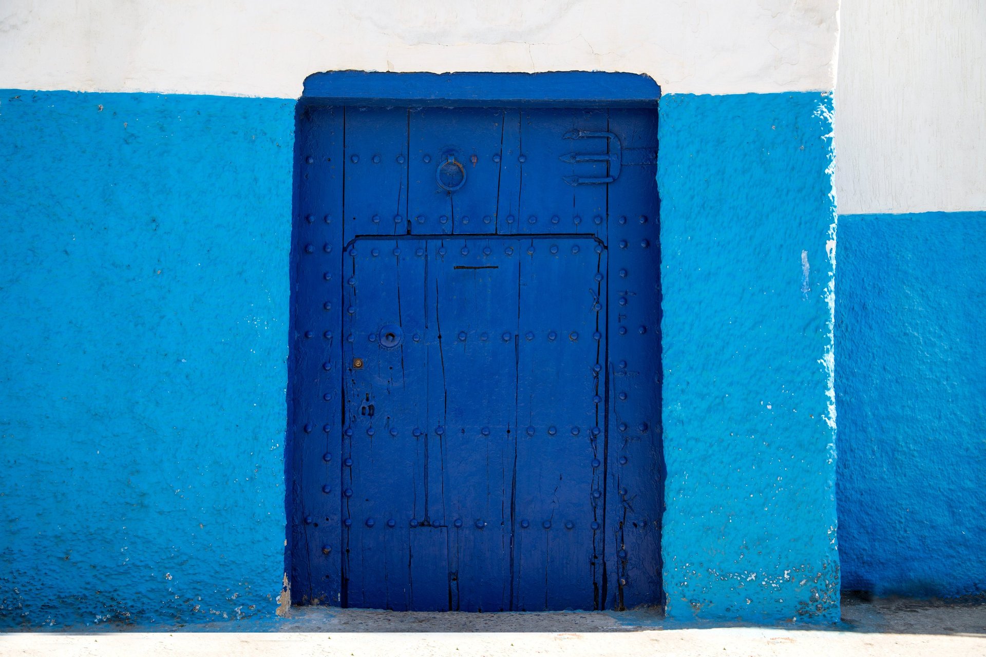 A woman walking down a street in a village