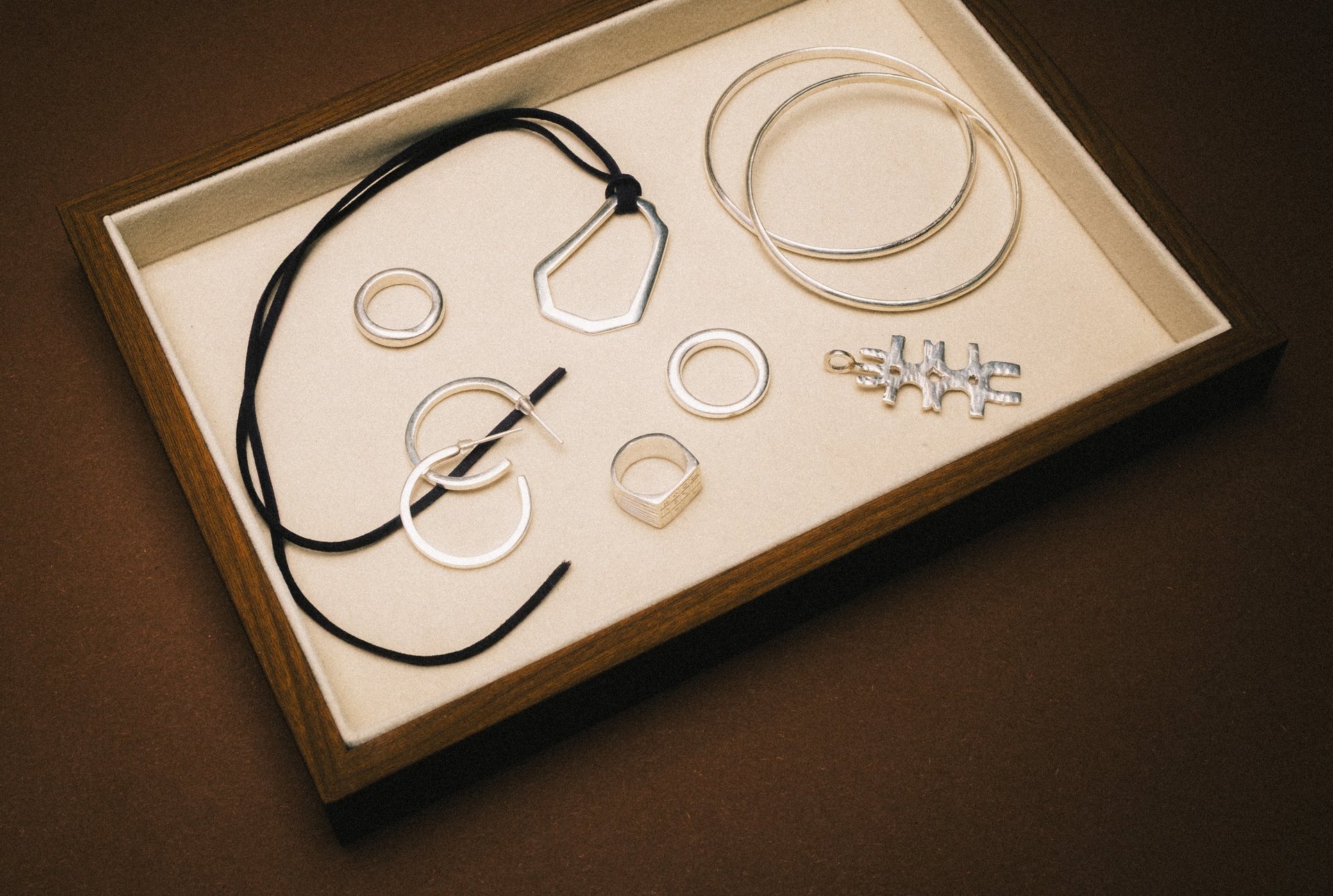 three camels with people riding them in the desert