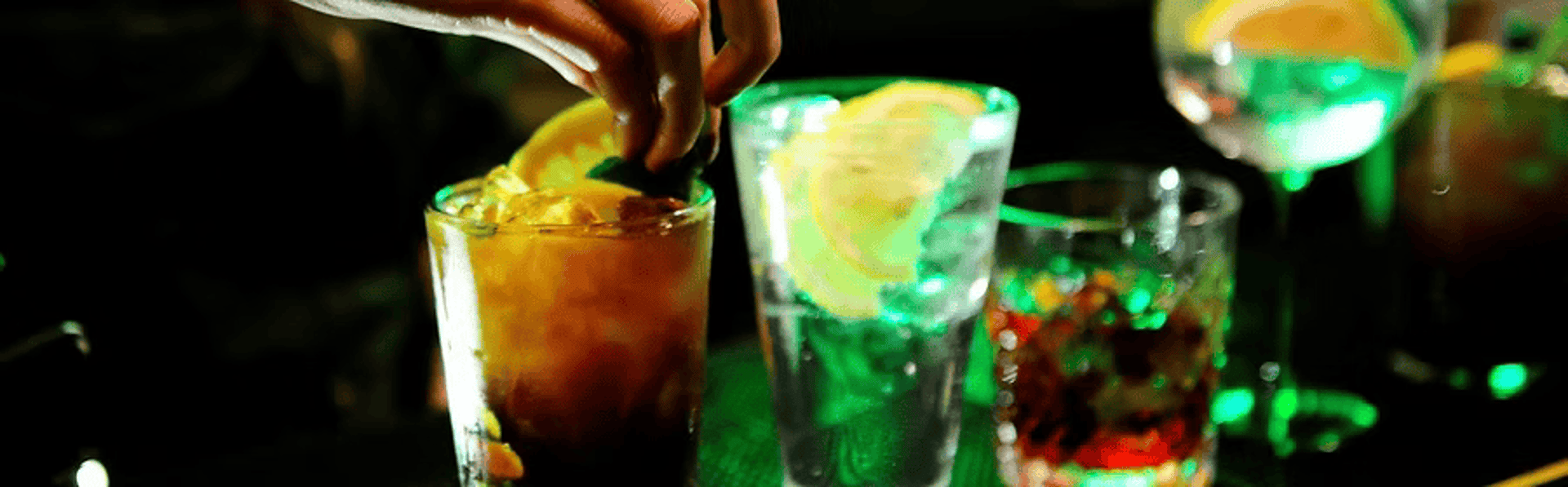 person holding beer mug under keg tap