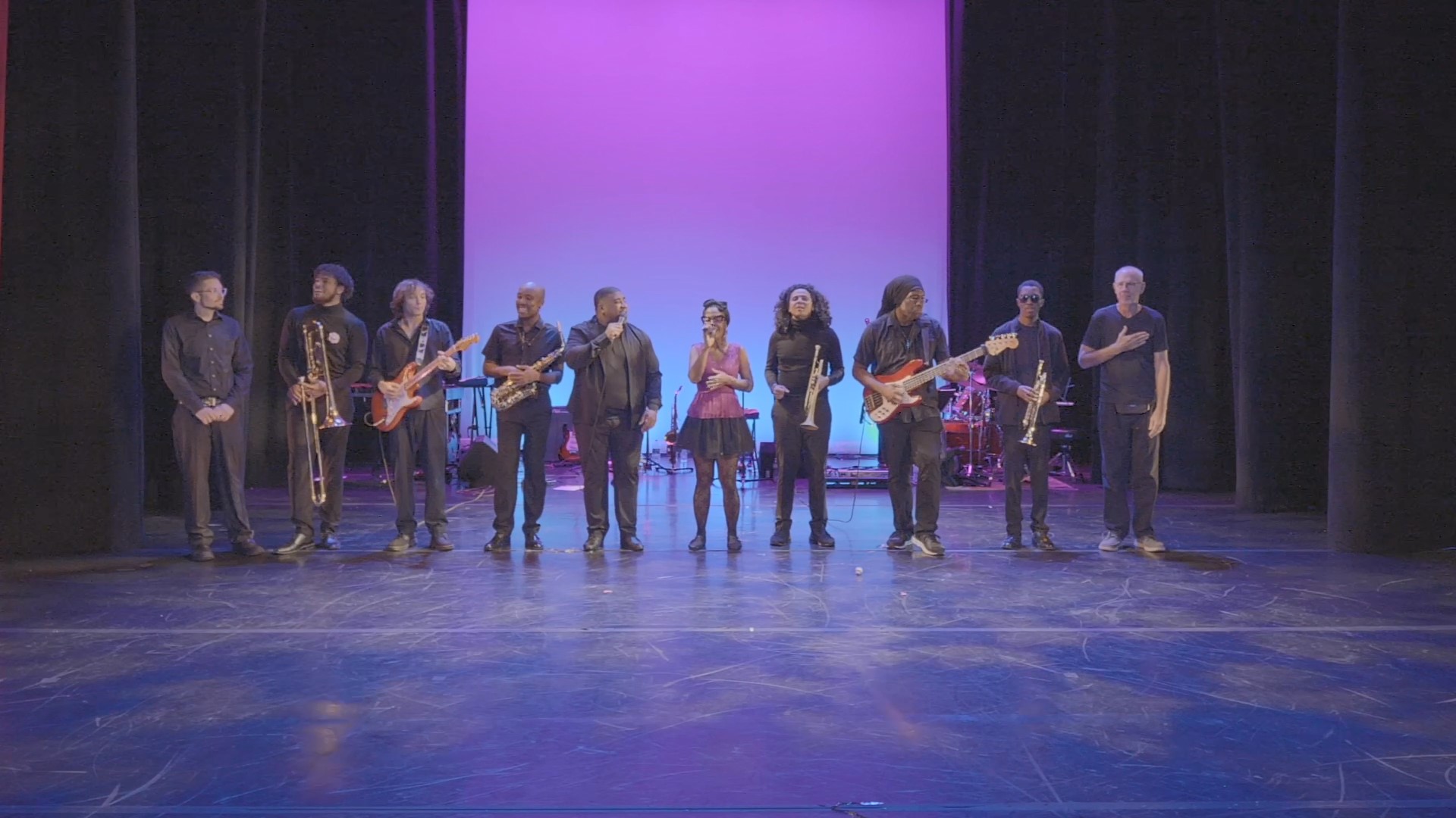 an abstract photo of a curved building with a blue sky in the background