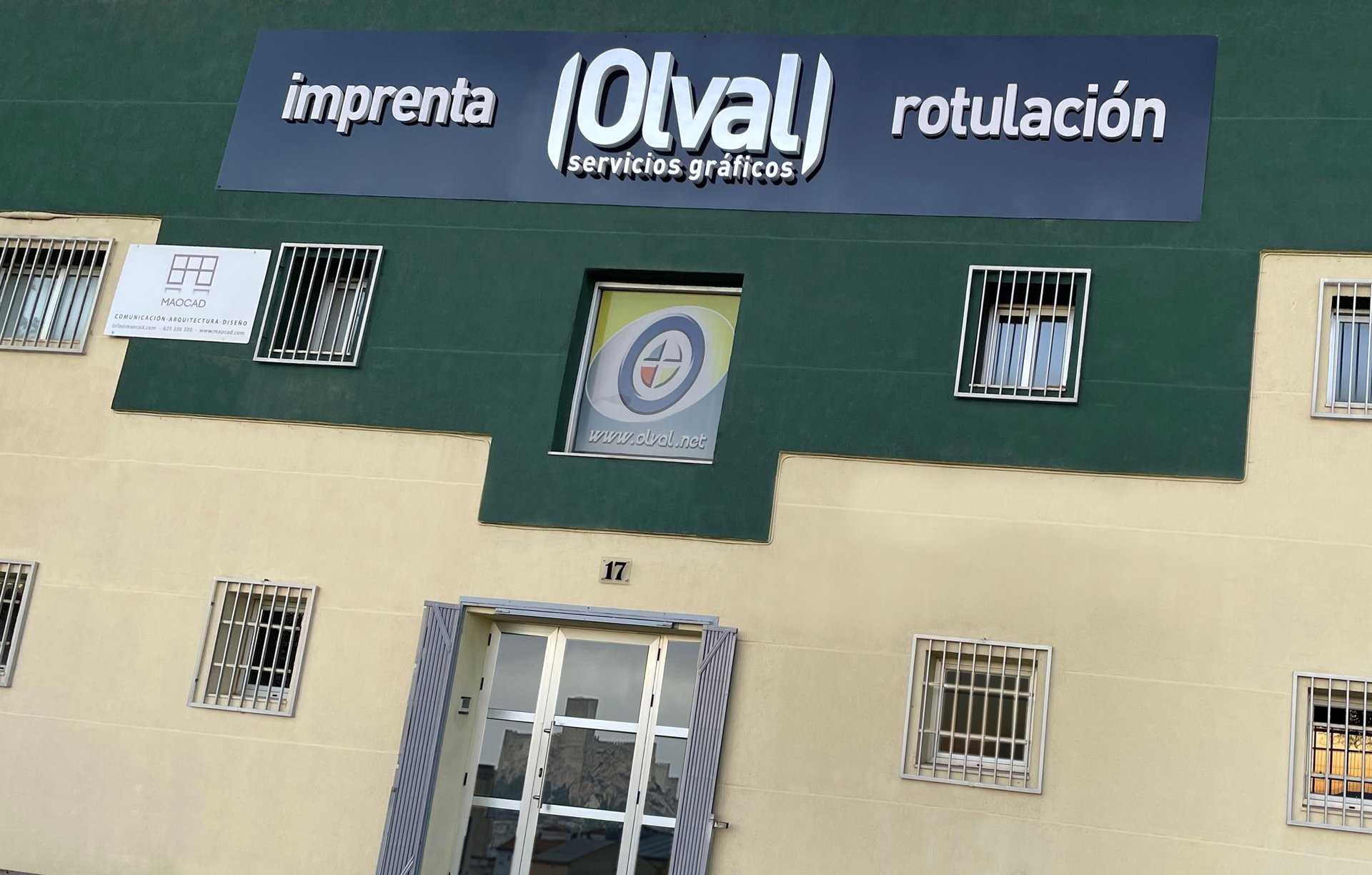 grayscale photography of man using machine