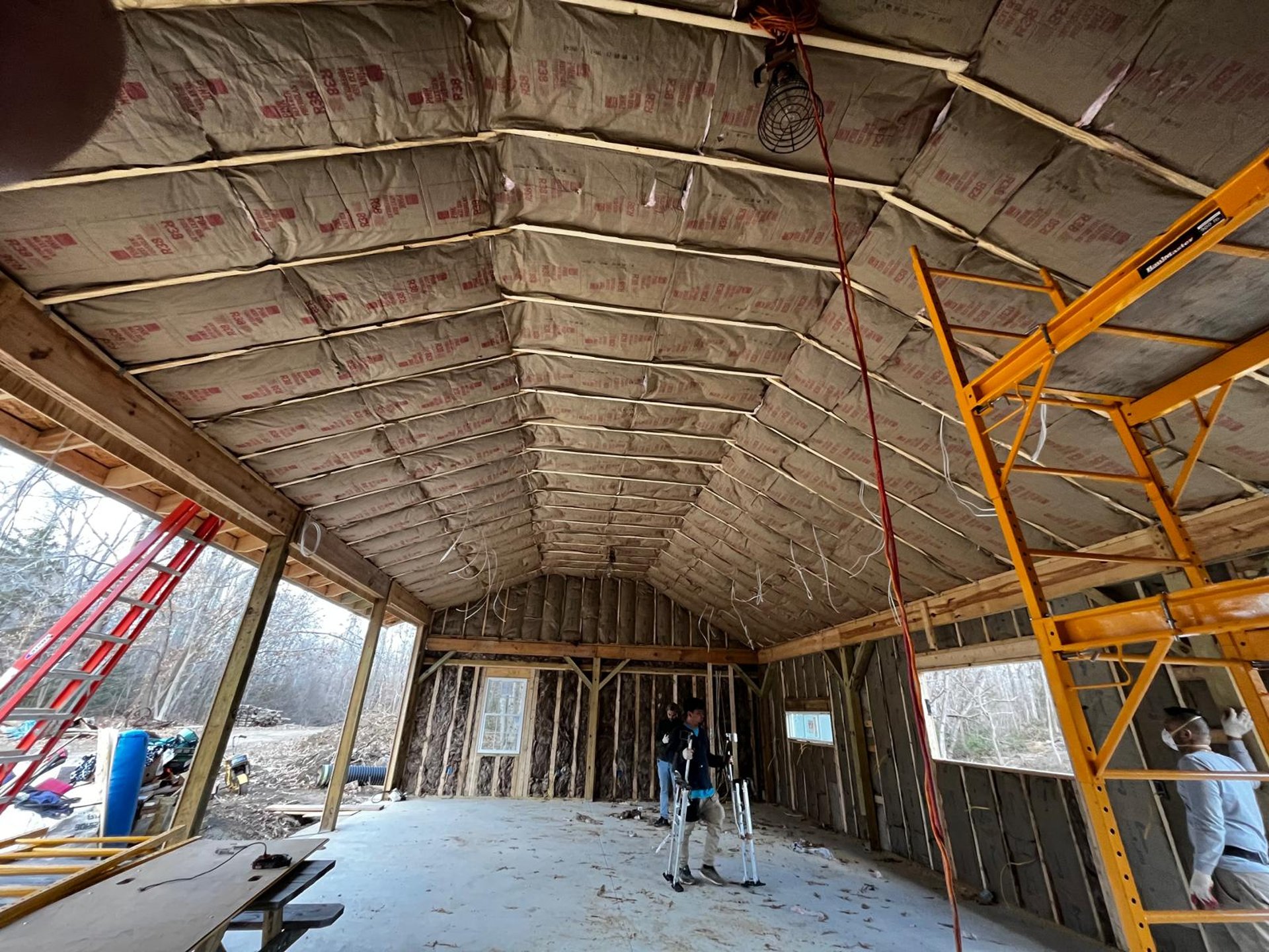 man in green crew neck t-shirt holding smoking pipe
