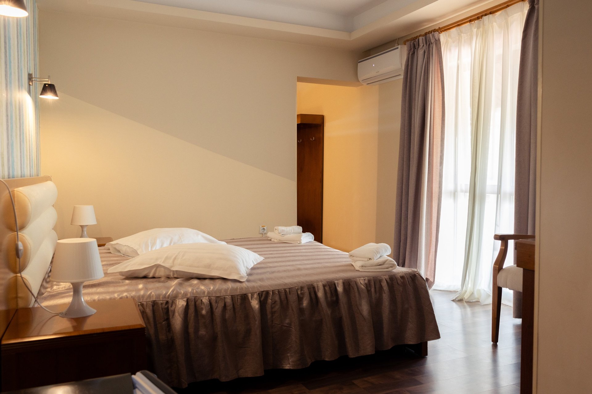 an abstract photo of a curved building with a blue sky in the background