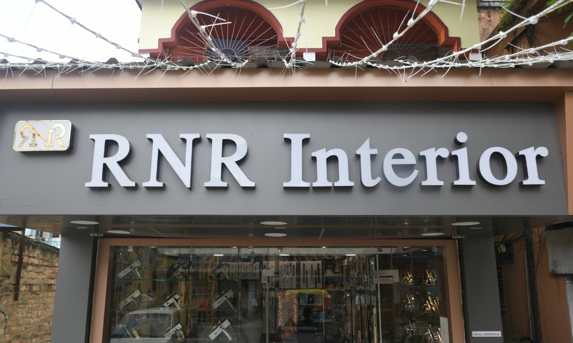 a group of tall buildings under a cloudy blue sky