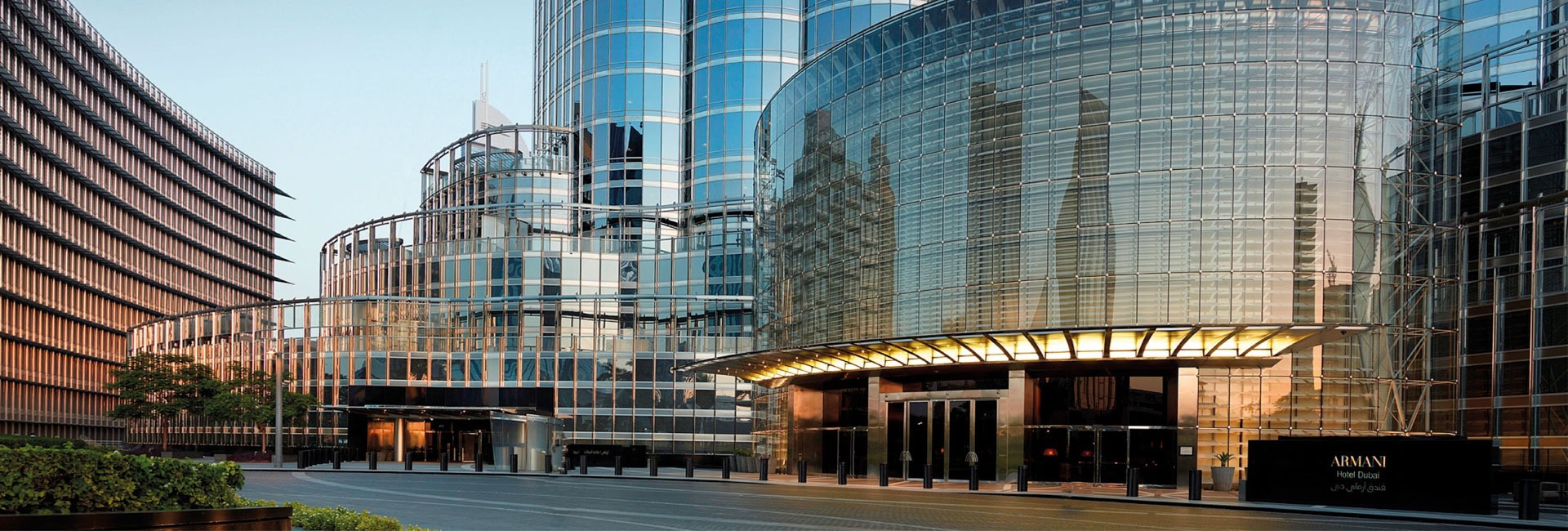 an abstract photo of a curved building with a blue sky in the background