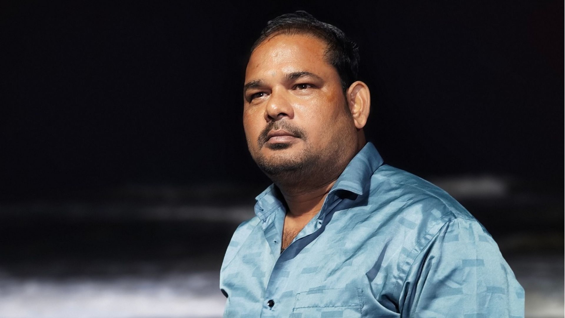 a group of women sitting around a table working on a project