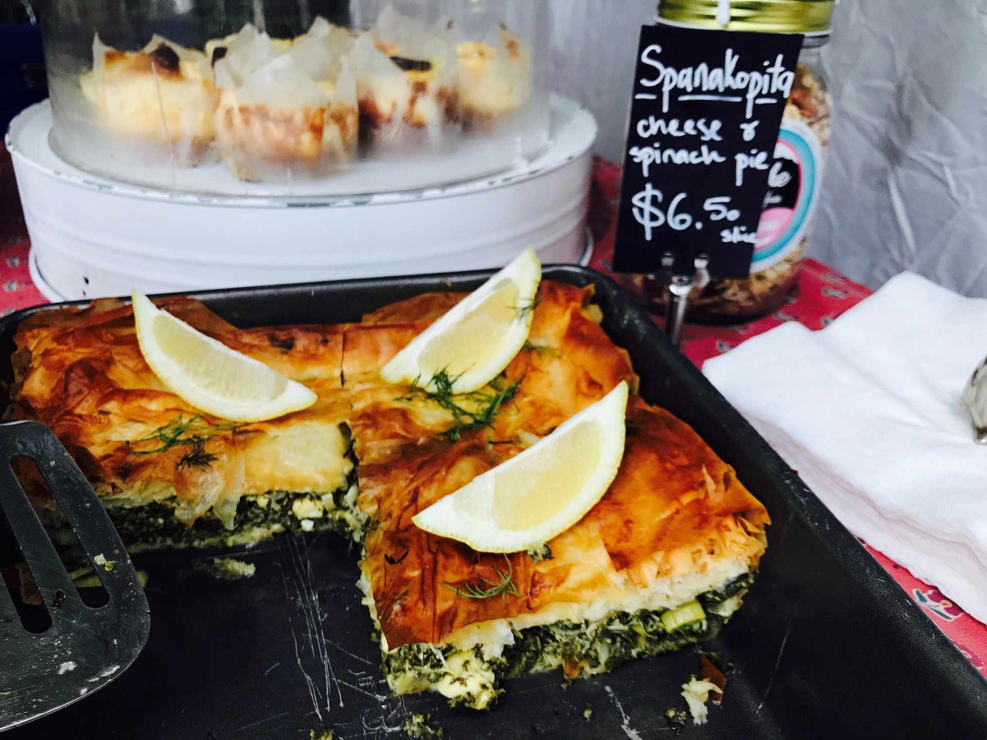 a slice of spinach and cheese quiche on a plate