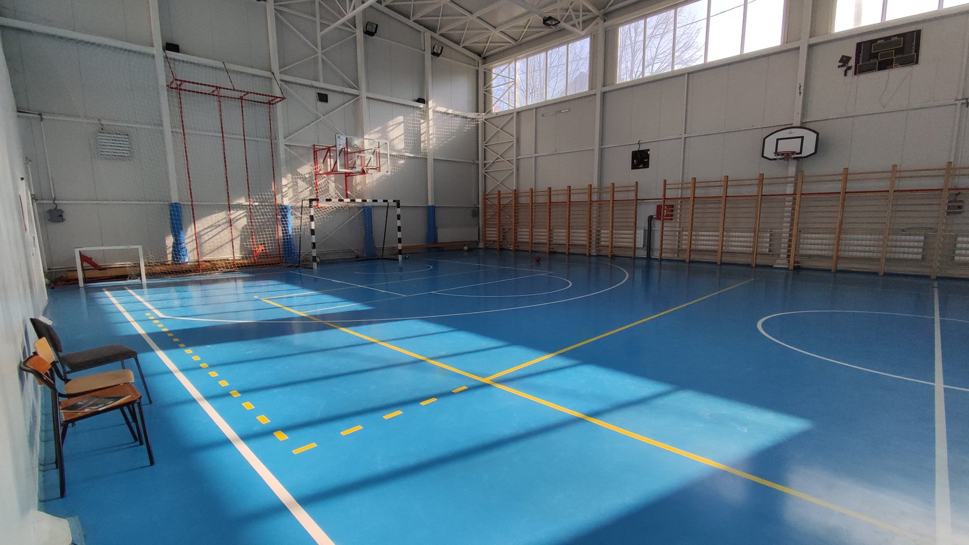 woman wearing yellow long-sleeved dress under white clouds and blue sky during daytime