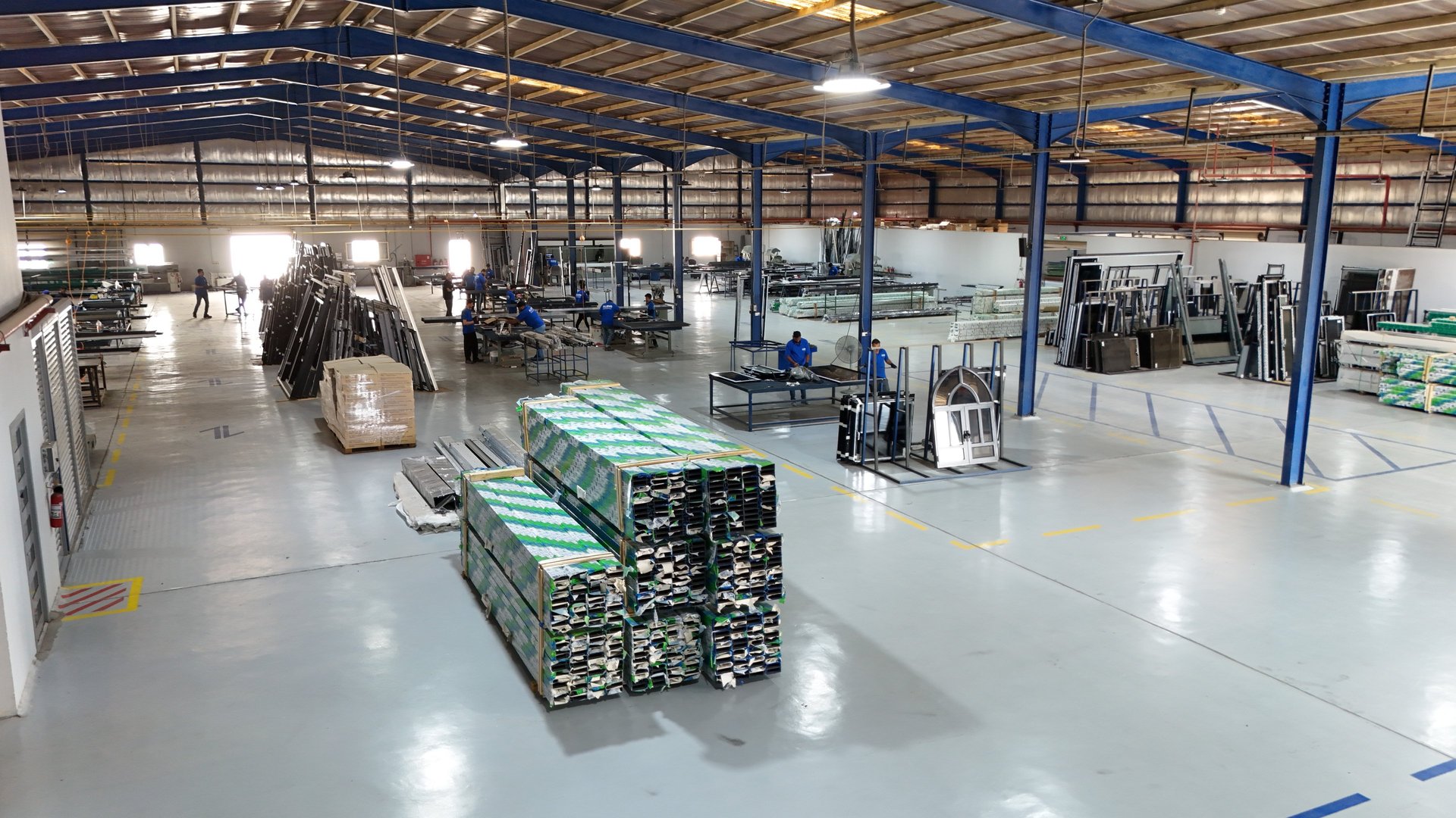 an abstract photo of a curved building with a blue sky in the background