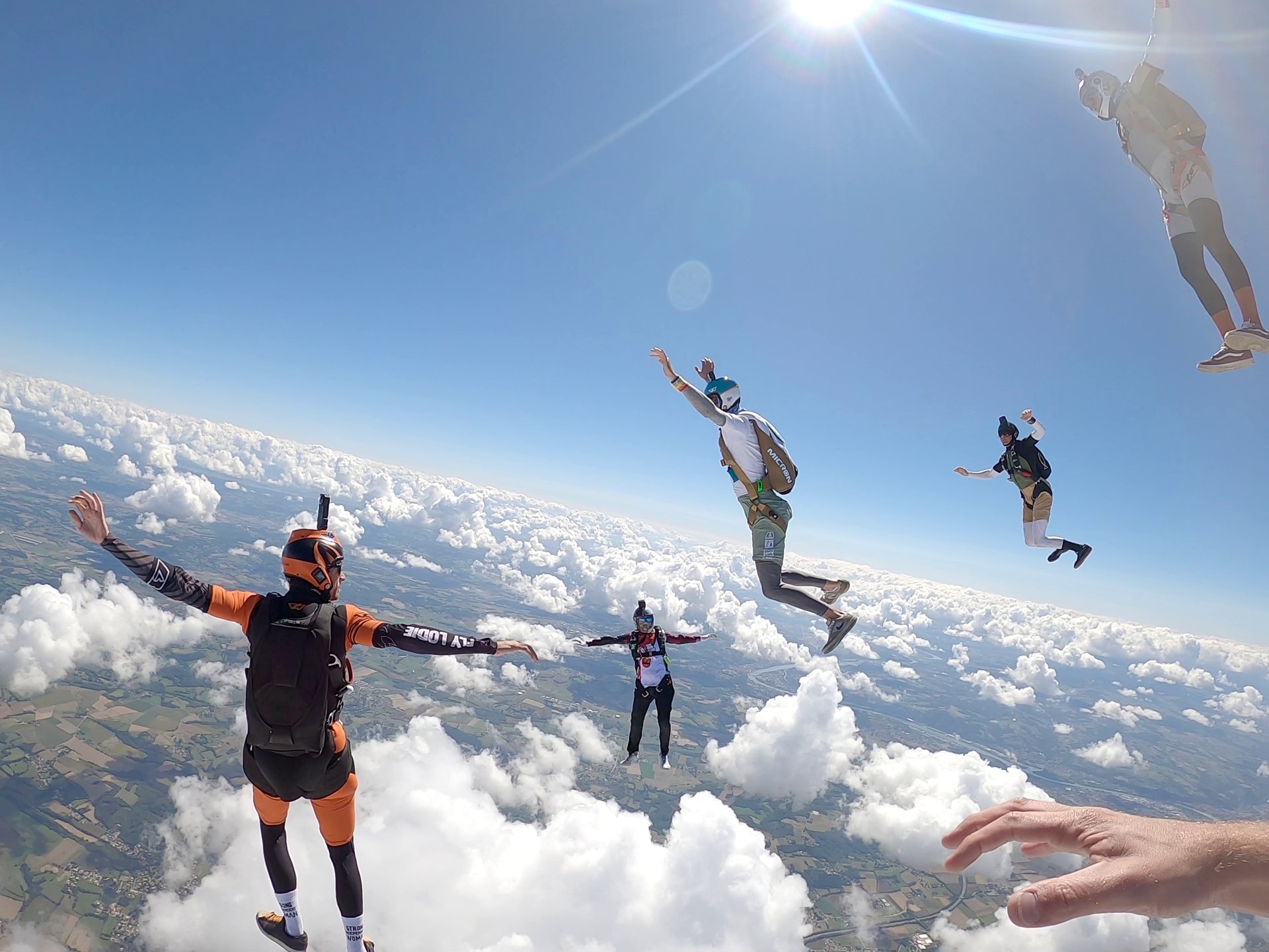 woman wearing yellow long-sleeved dress under white clouds and blue sky during daytime