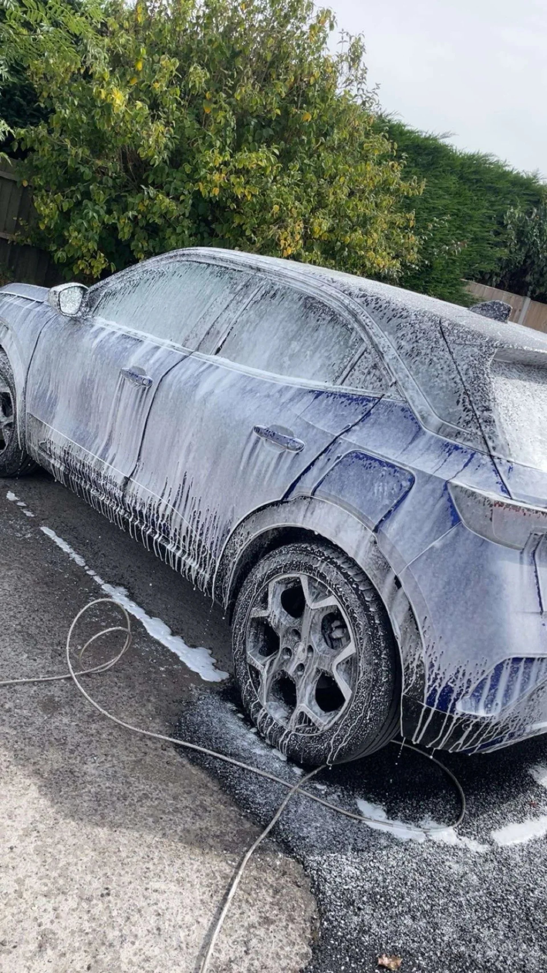Car Being Washed Covered In Foam