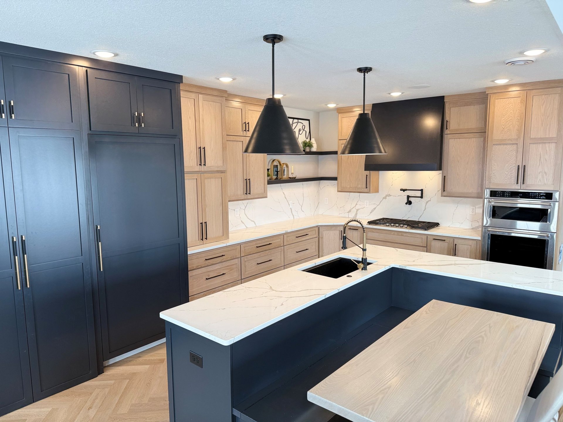 white wooden kitchen cabinet and stainless steel microwave oven