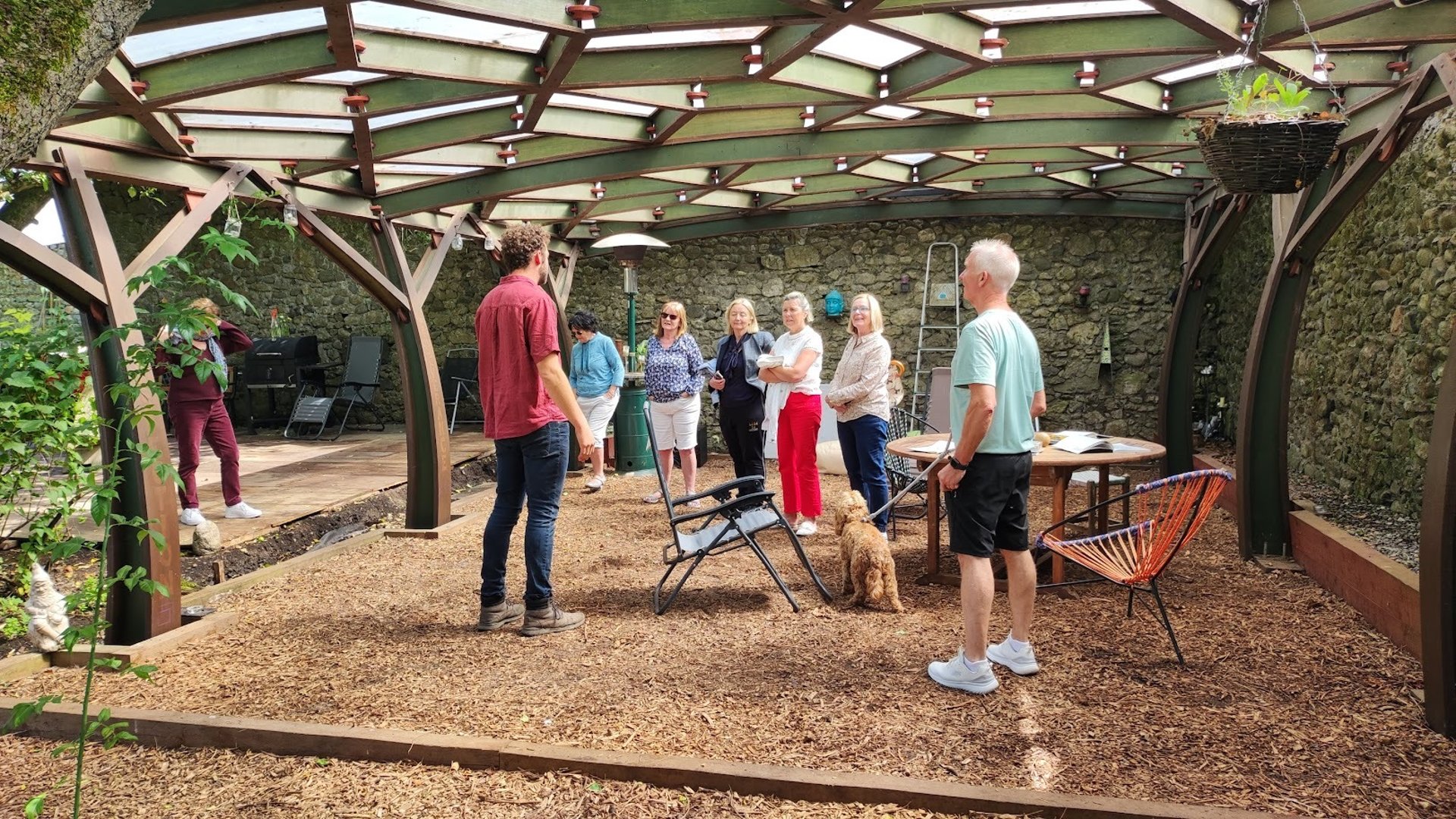 a group of people holding hands on top of a tree