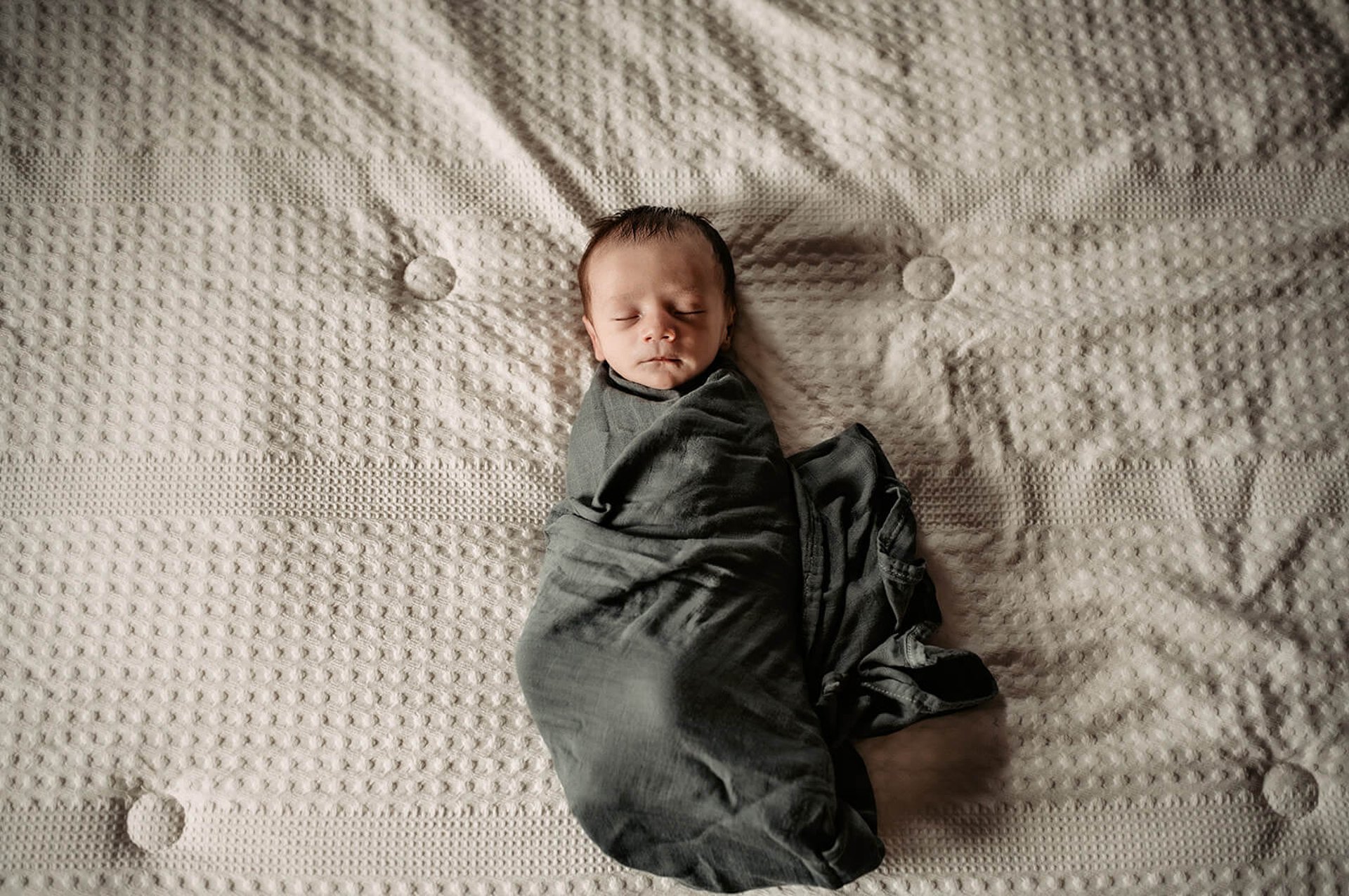 an abstract photo of a curved building with a blue sky in the background
