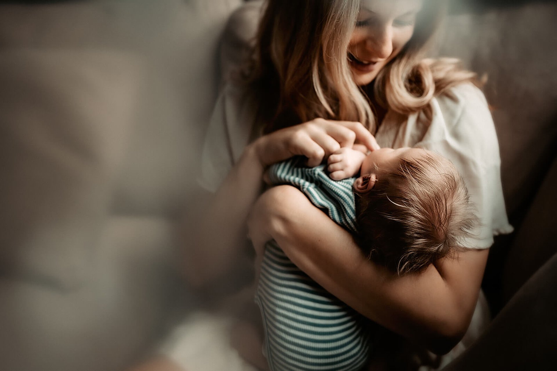 an abstract photo of a curved building with a blue sky in the background