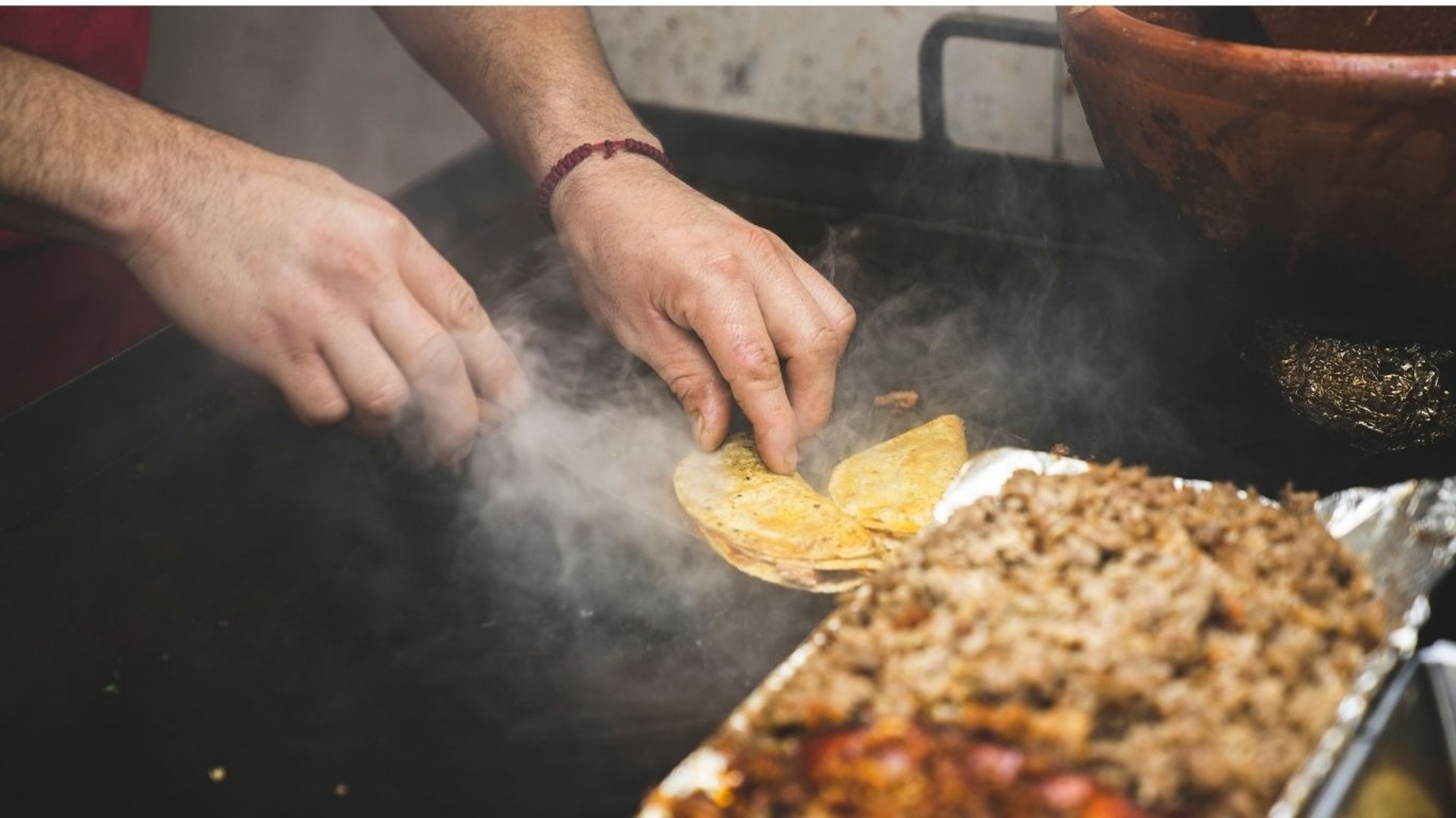 an abstract photo of a curved building with a blue sky in the background