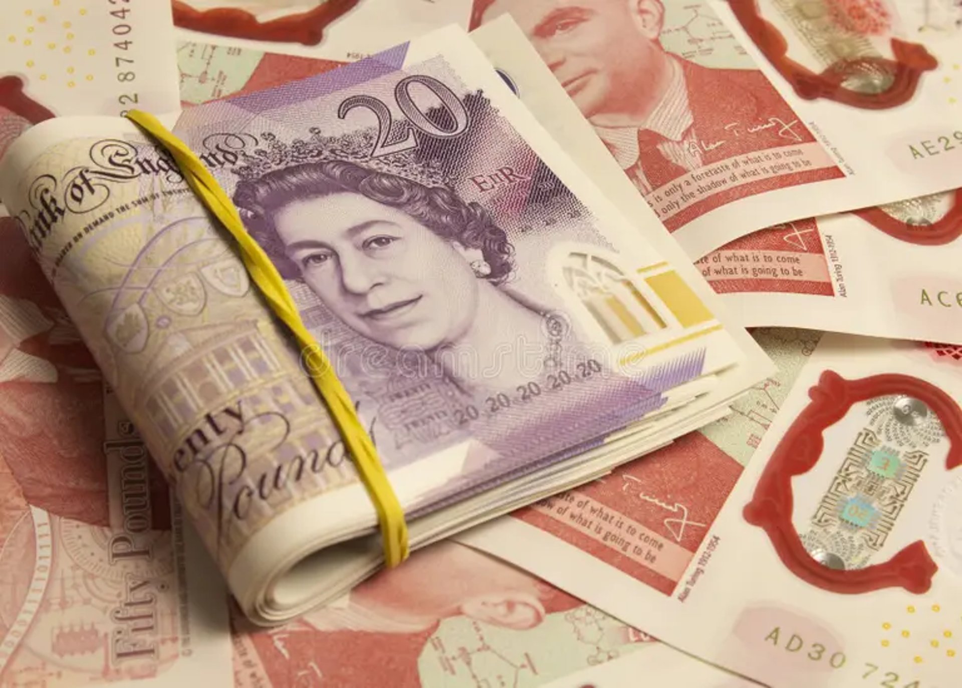 A pile of money sitting next to a calculator