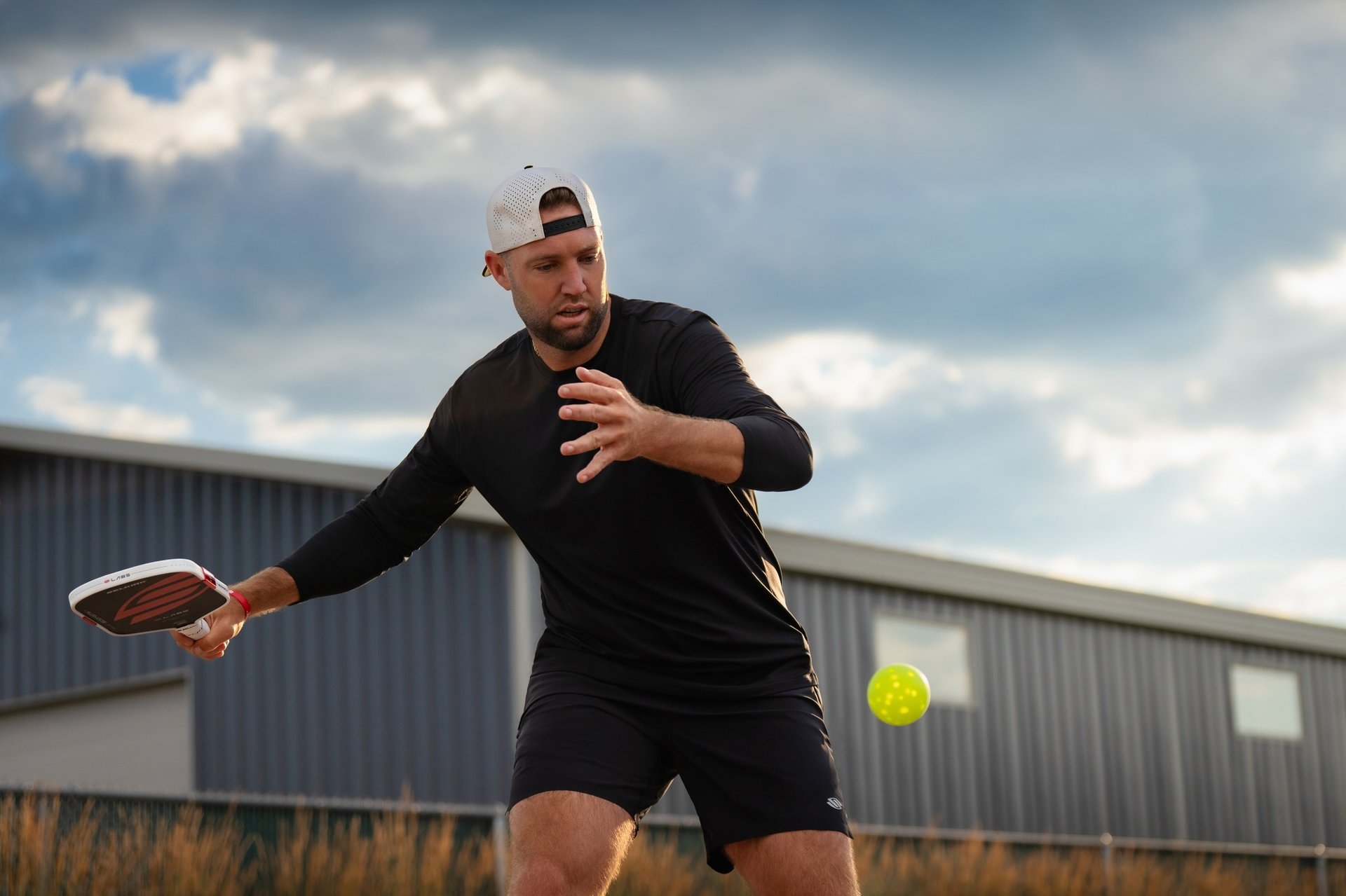 an abstract photo of a curved building with a blue sky in the background