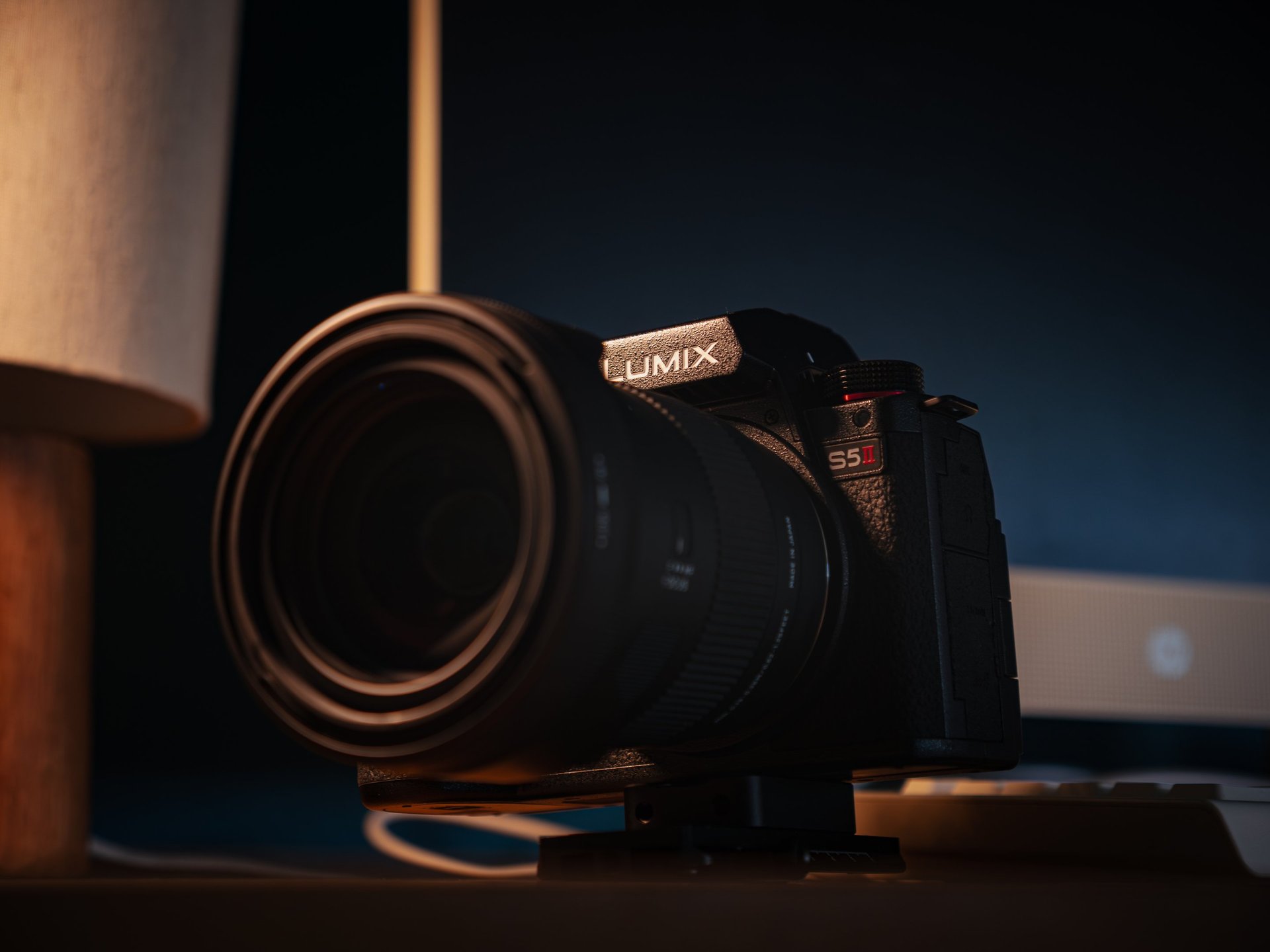 black nikon dslr camera on white table