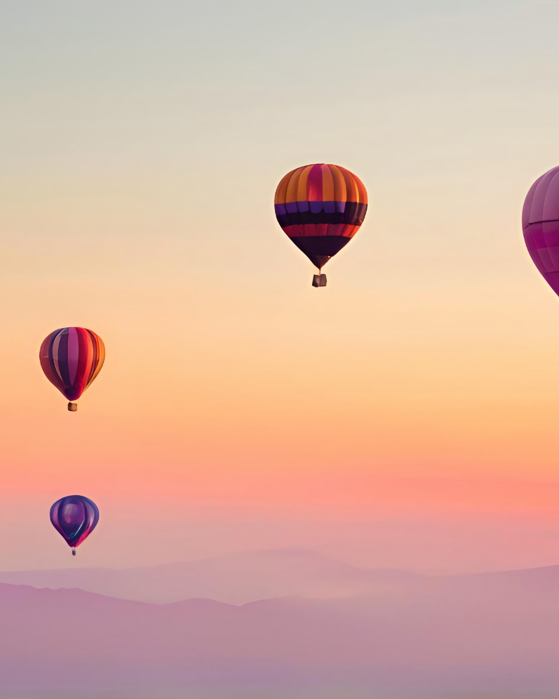 person holding gold and silver compass