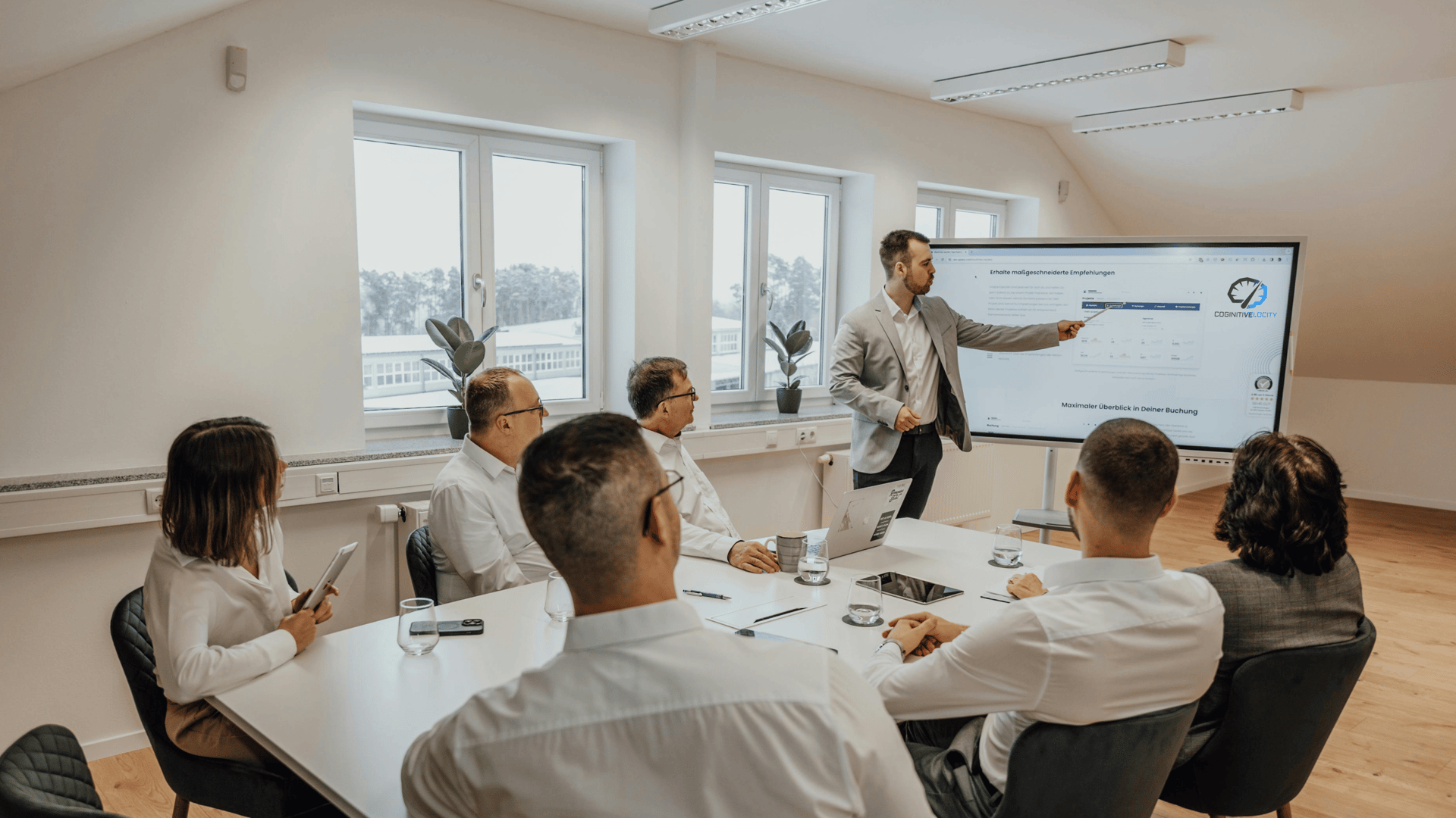 a man giving a presentation to a group of people