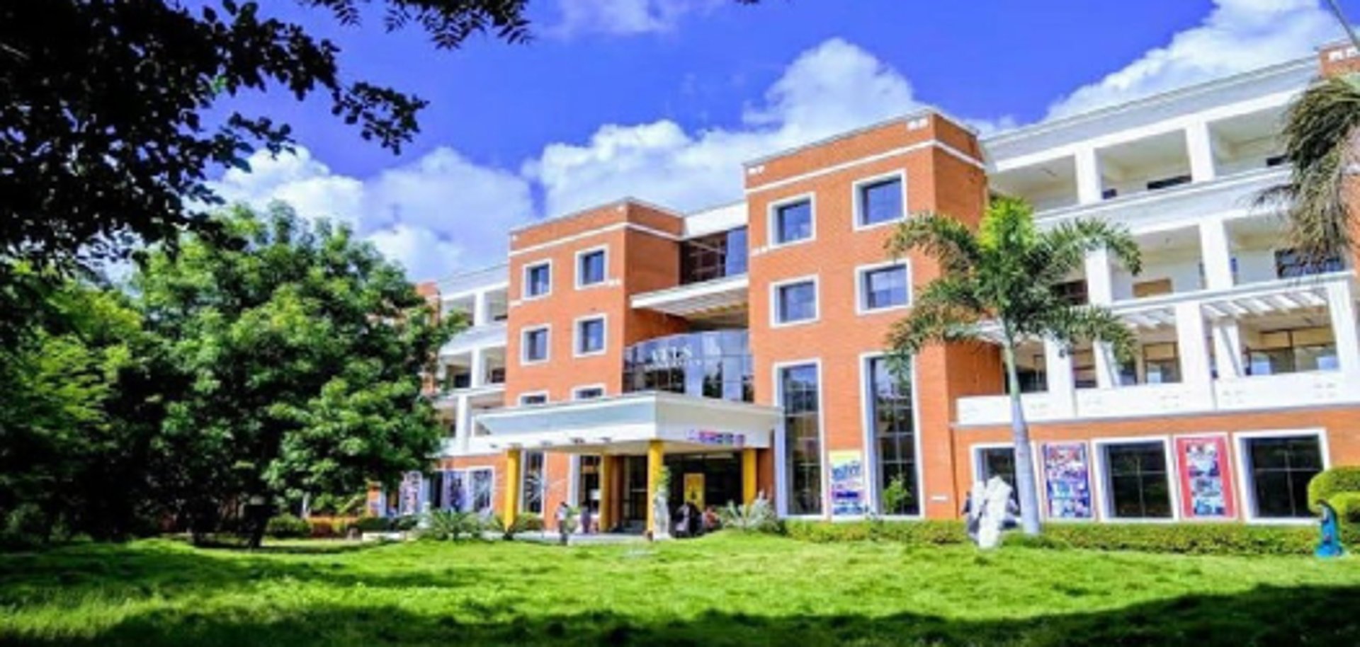 an abstract photo of a curved building with a blue sky in the background