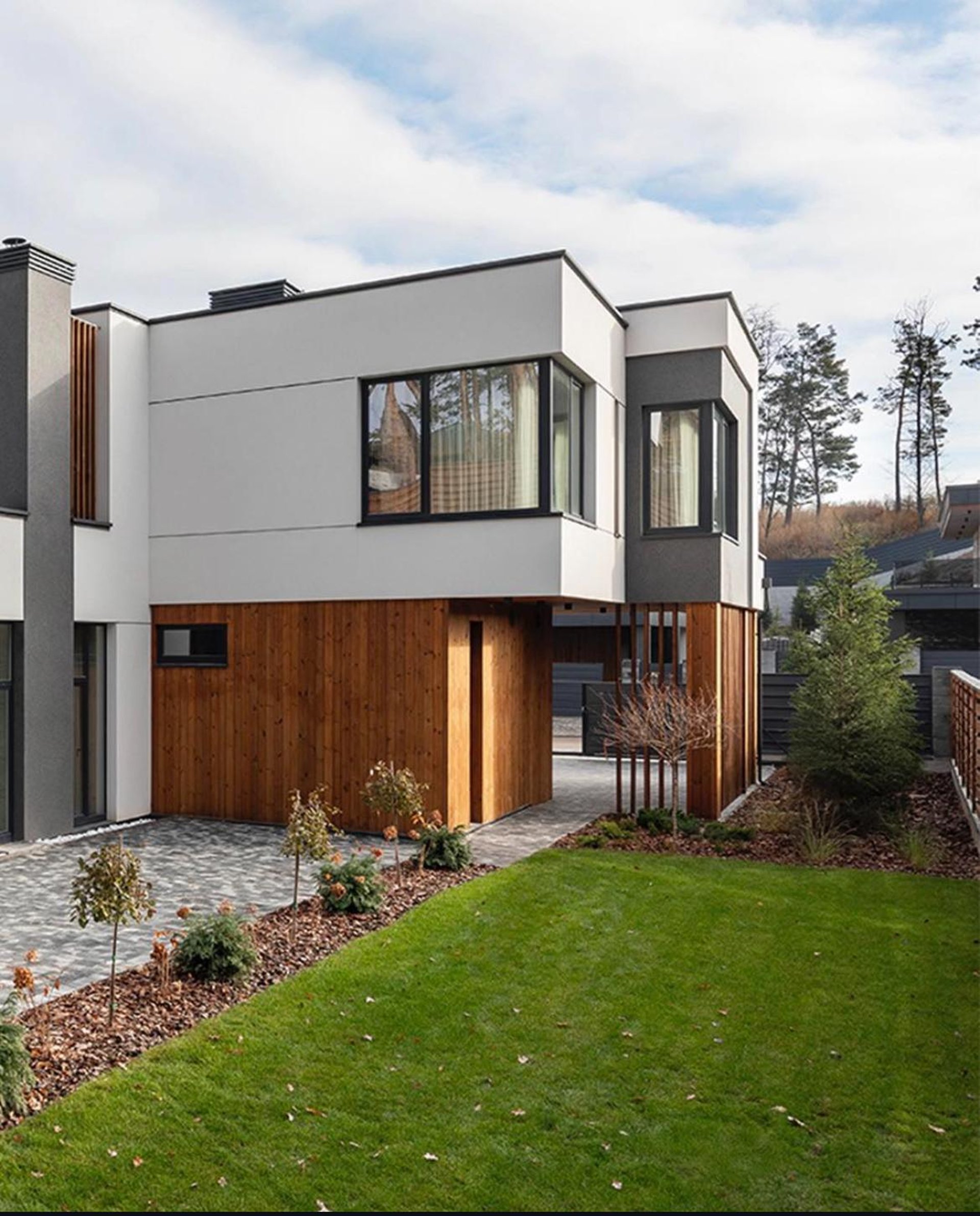 an abstract photo of a curved building with a blue sky in the background