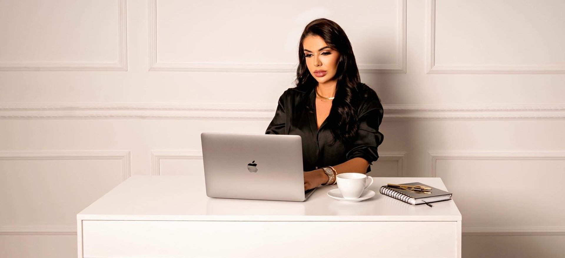 an abstract photo of a curved building with a blue sky in the background