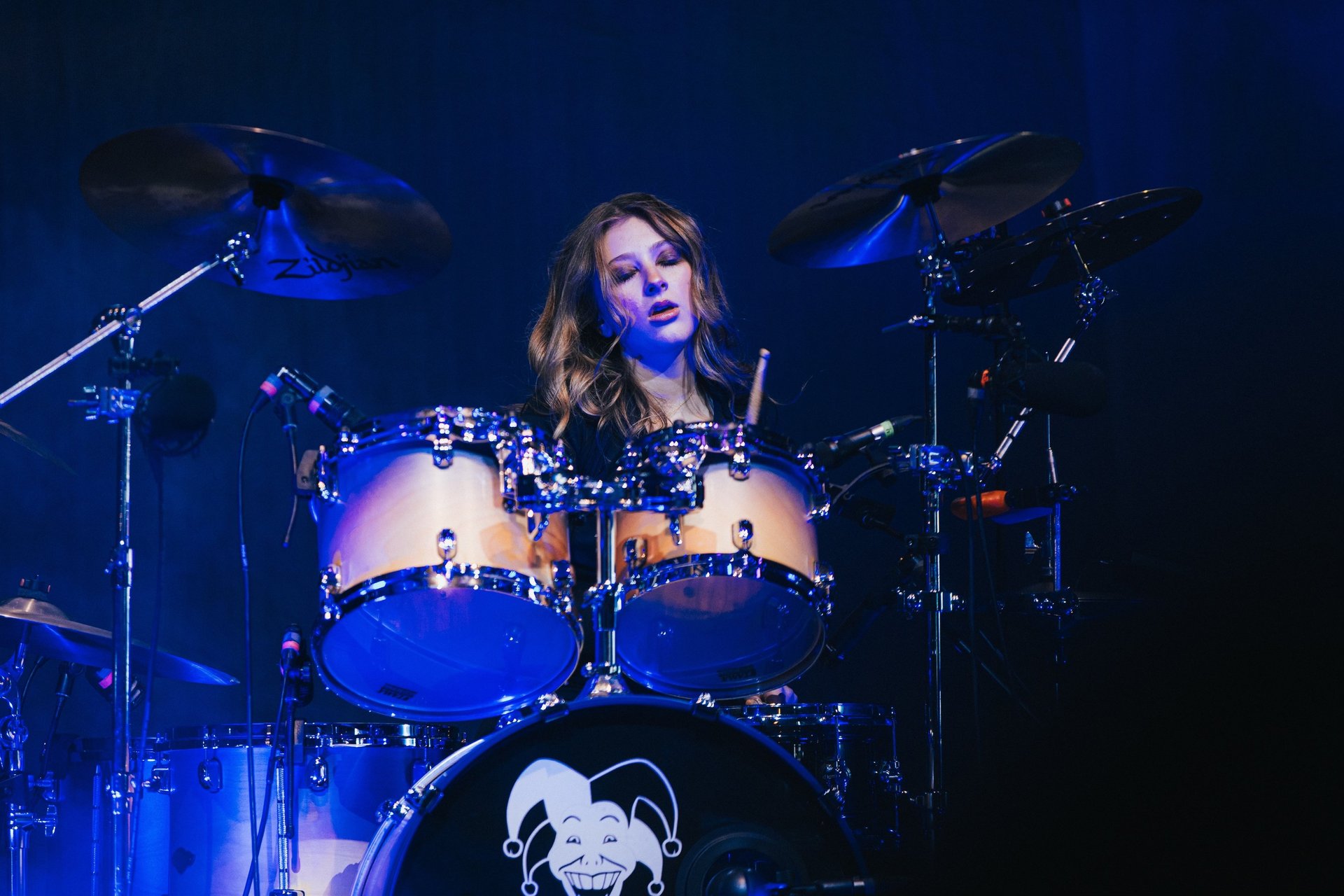 woman wearing yellow long-sleeved dress under white clouds and blue sky during daytime