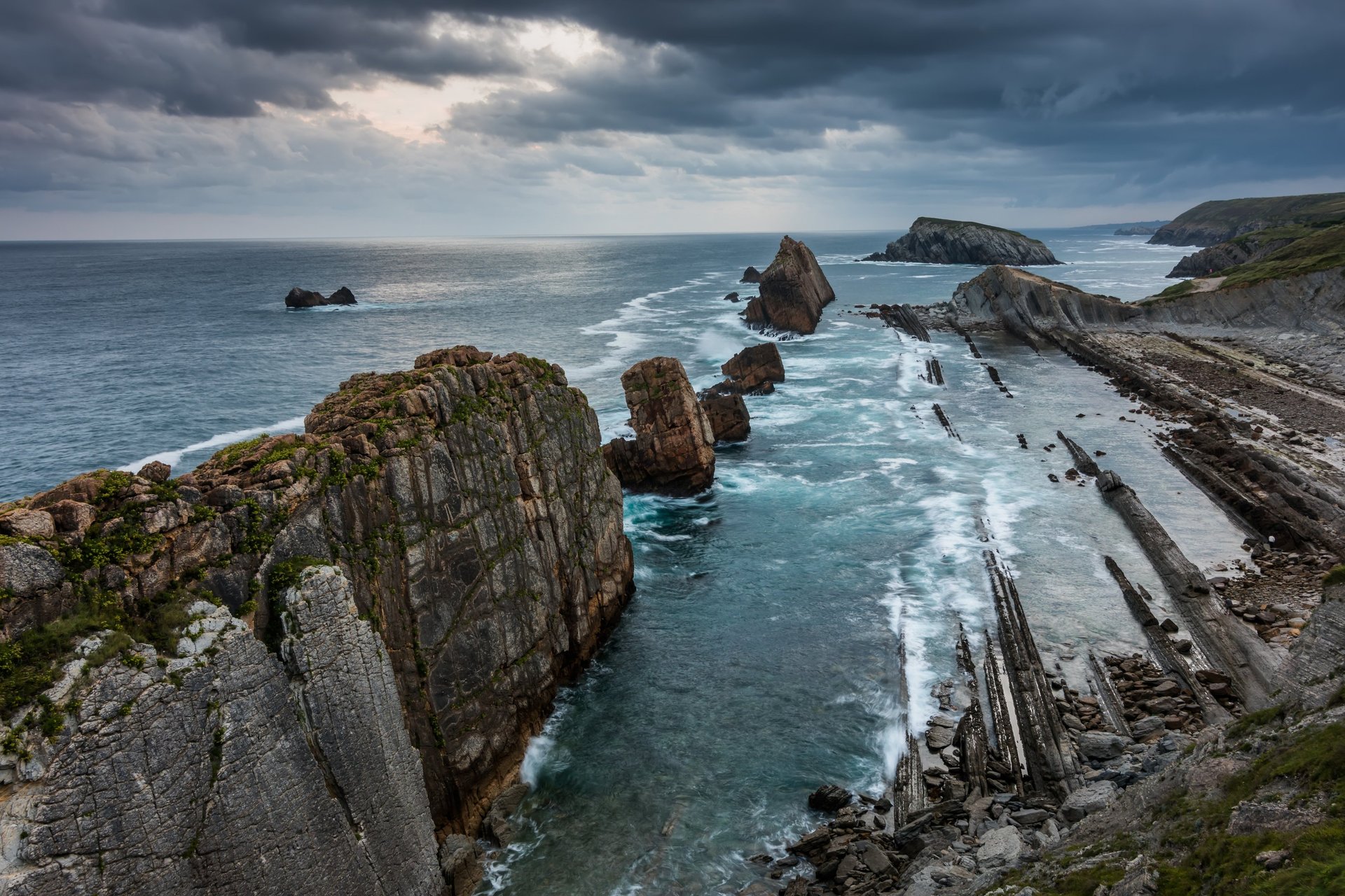 an abstract photo of a curved building with a blue sky in the background