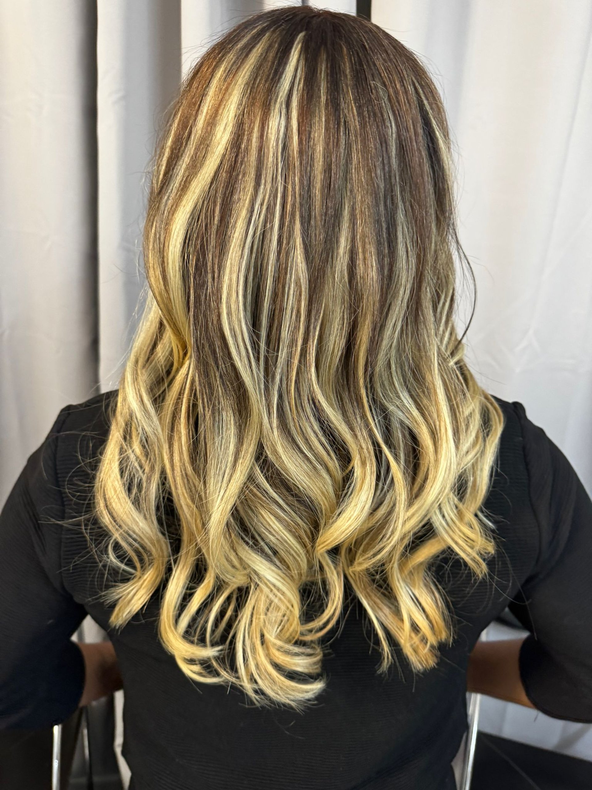 woman wearing yellow long-sleeved dress under white clouds and blue sky during daytime