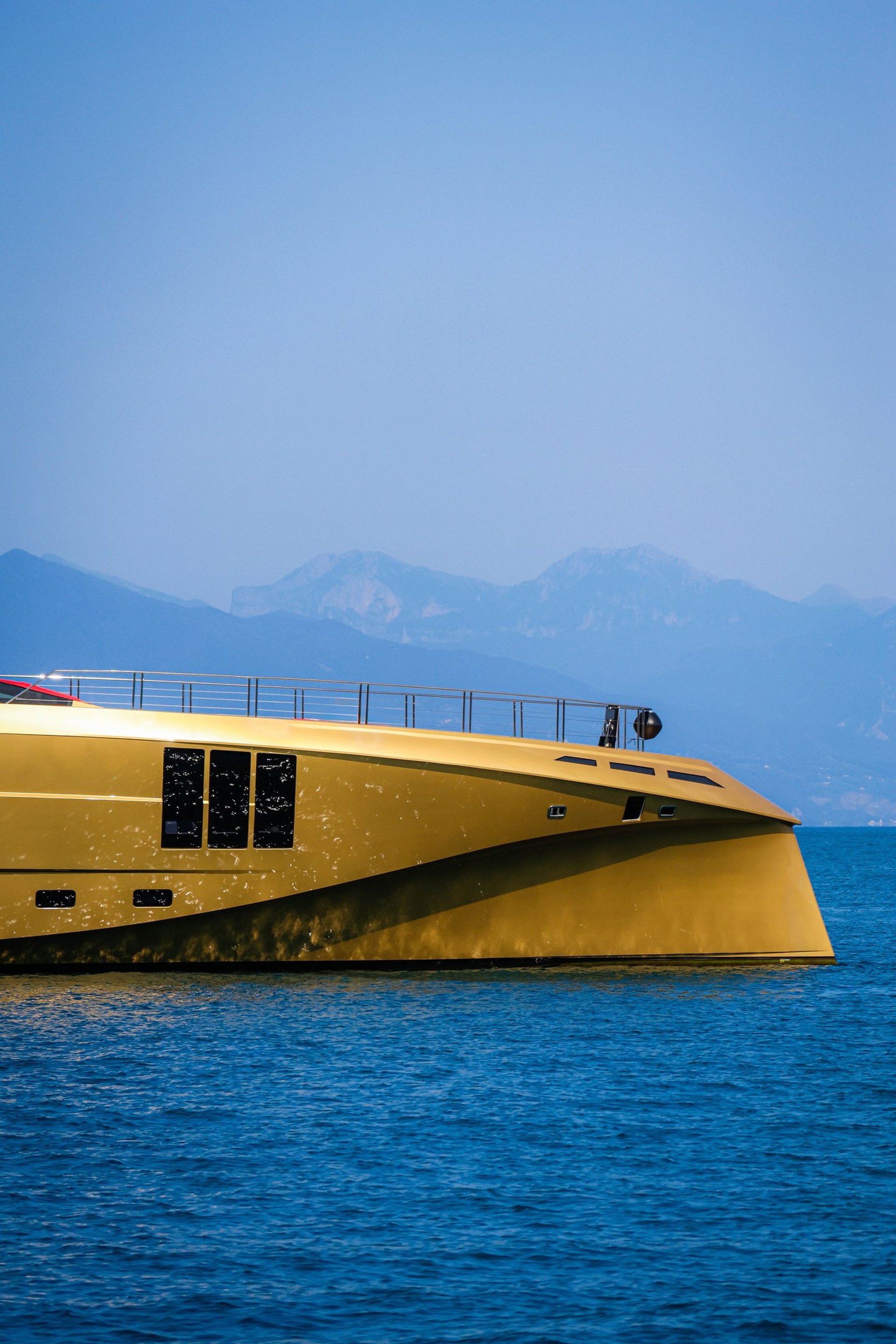 a rack of different colored spools of thread